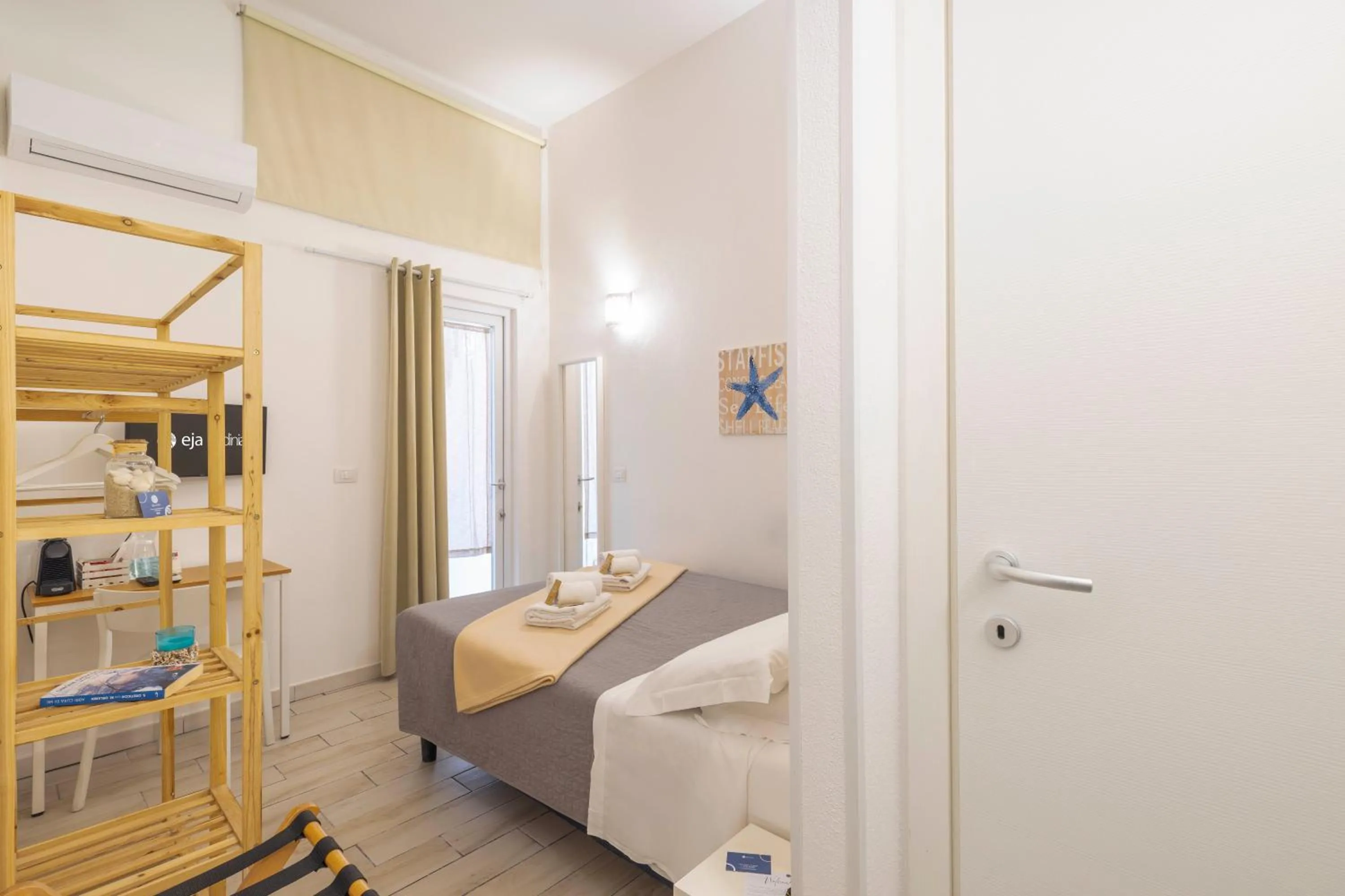 Bed in Approdo Rooms - Eja Sardinia