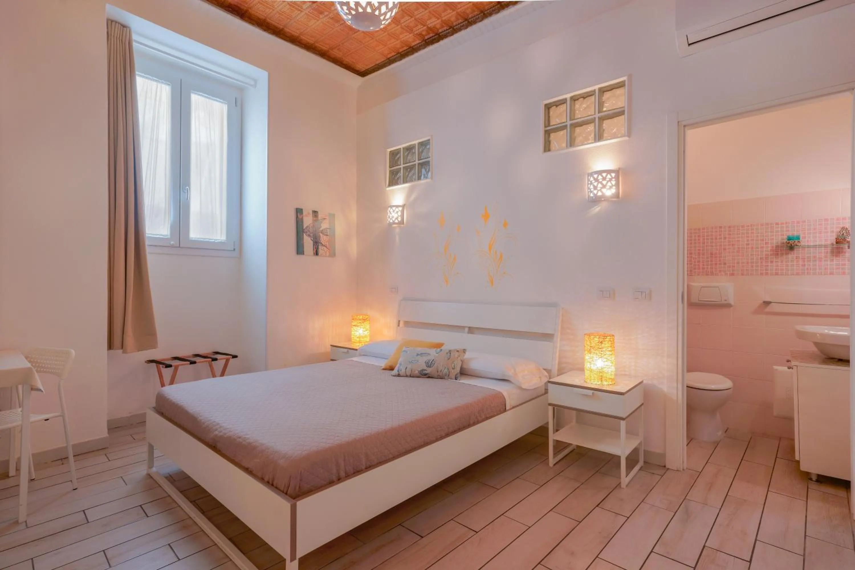 Bed in Approdo Rooms - Eja Sardinia