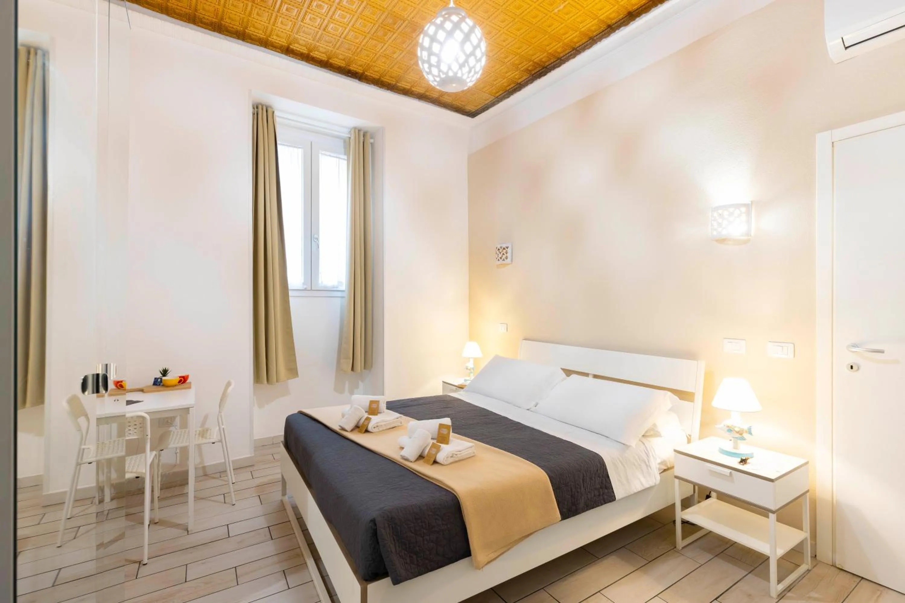Bed in Approdo Rooms - Eja Sardinia