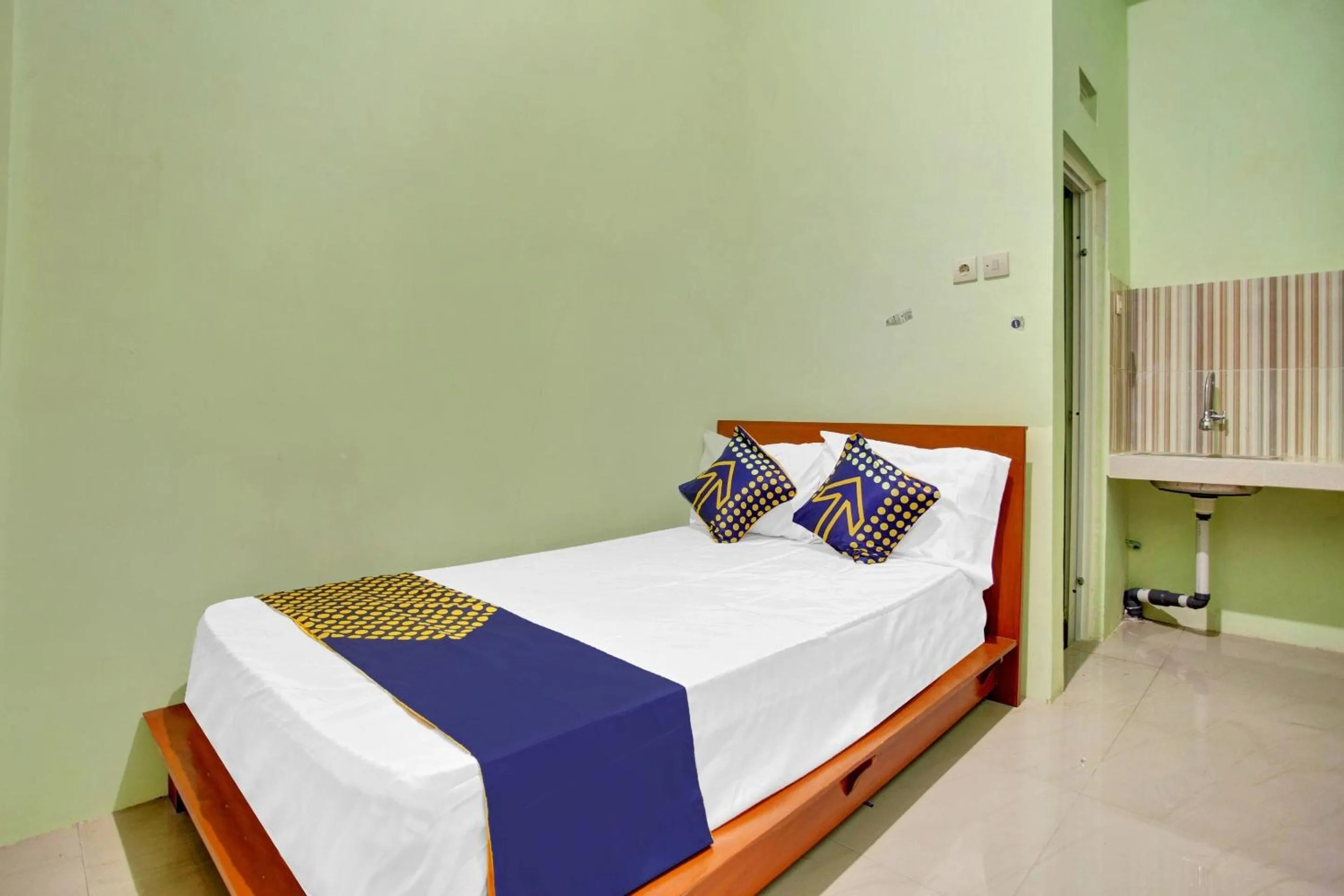 Bedroom in OYO 90537 De Wisma Emas