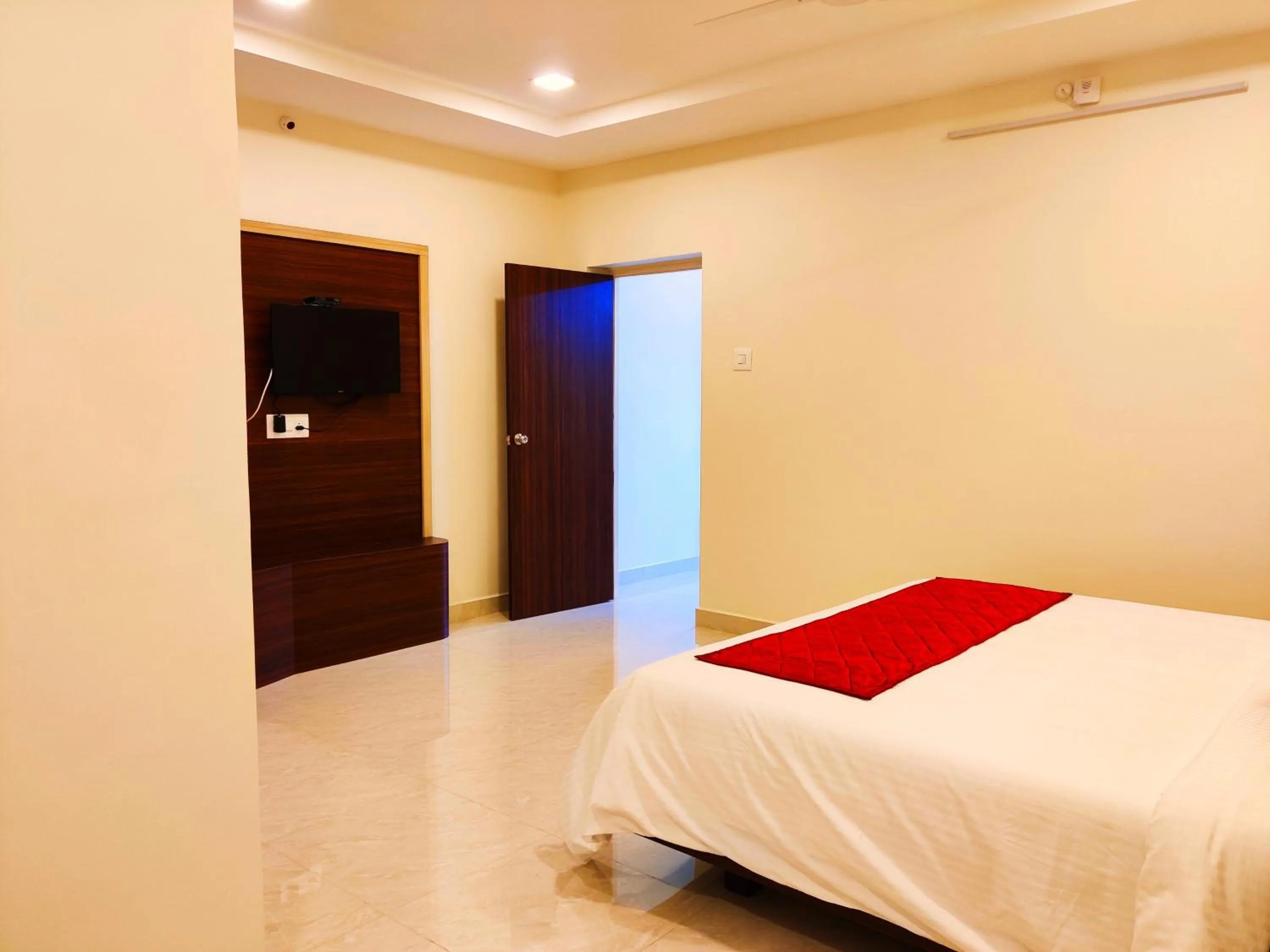 Photo of the whole room, Bed in THAAI RESIDENCY