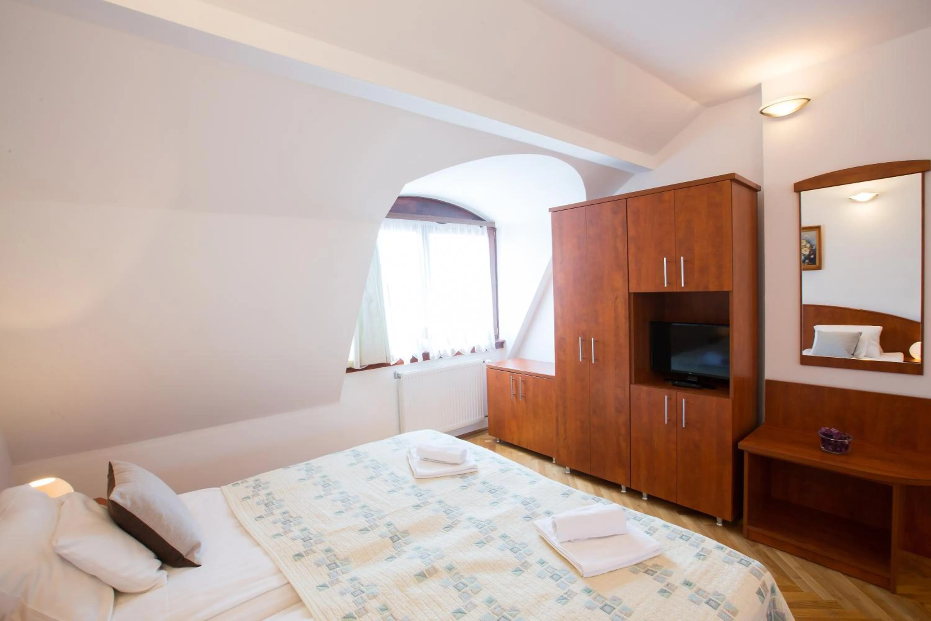 Bed in HELIOS Hotel Apartments