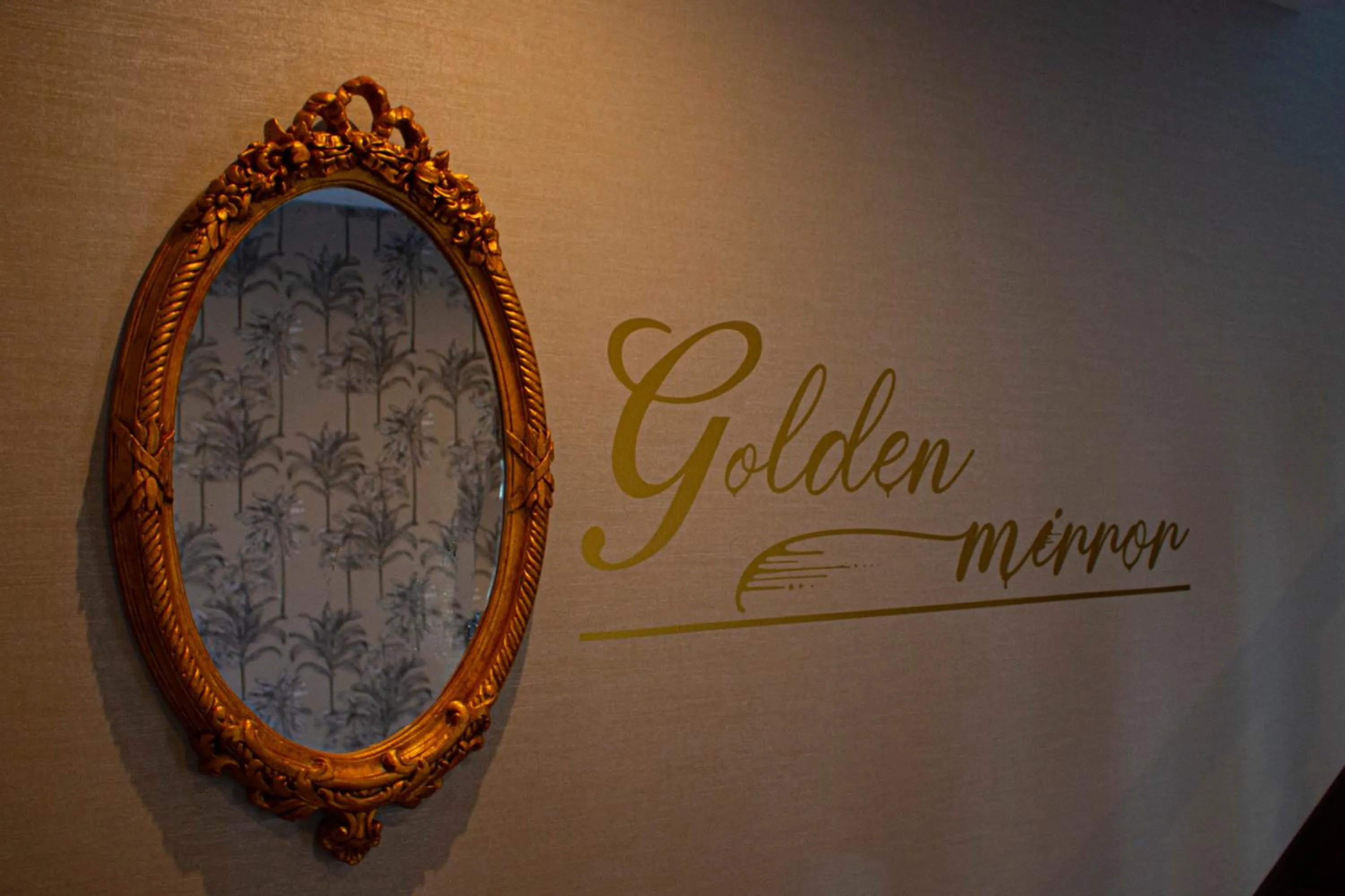 Property logo or sign in Golden Mirror