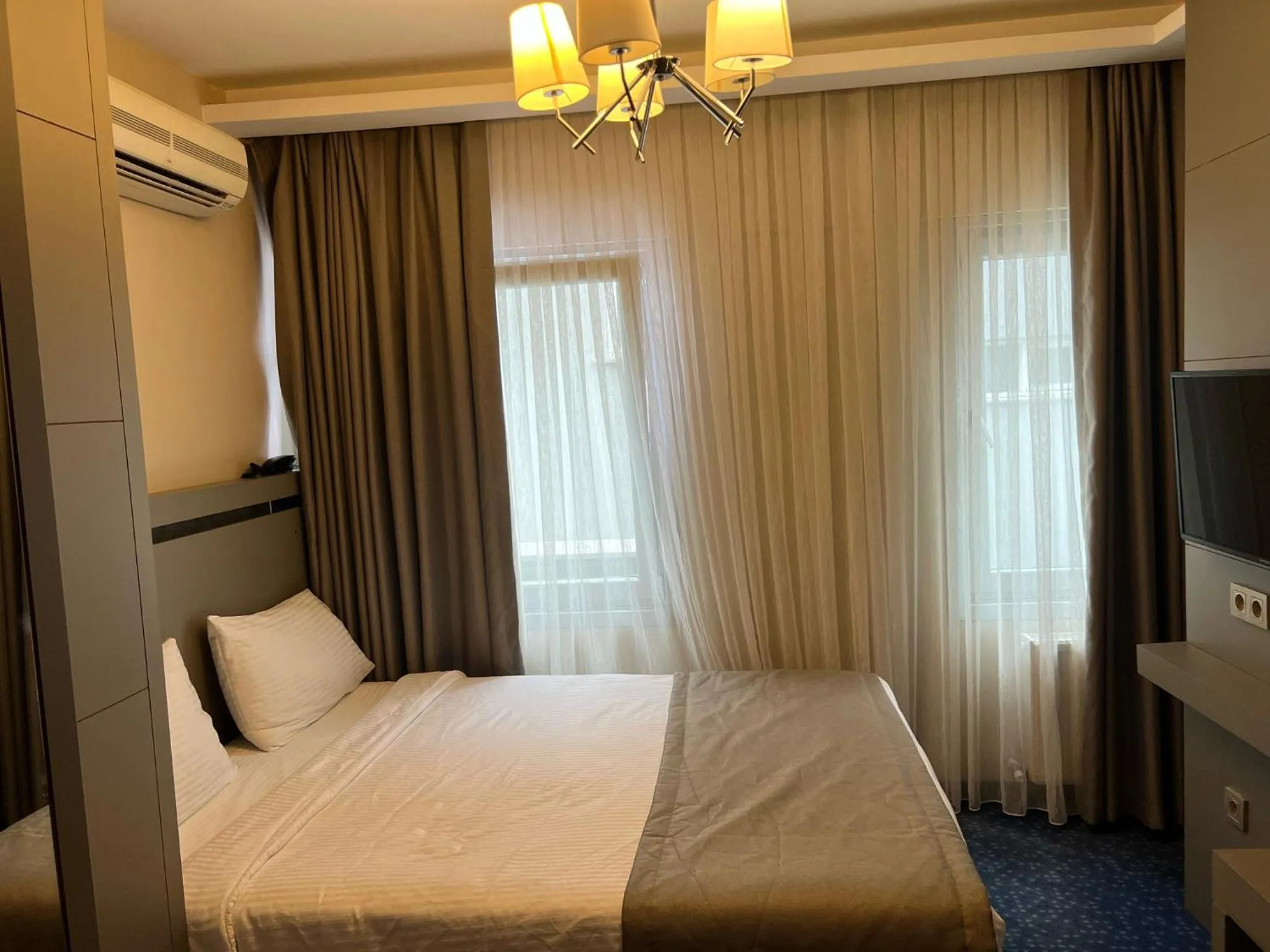 Bed in Acar Suite Hotel