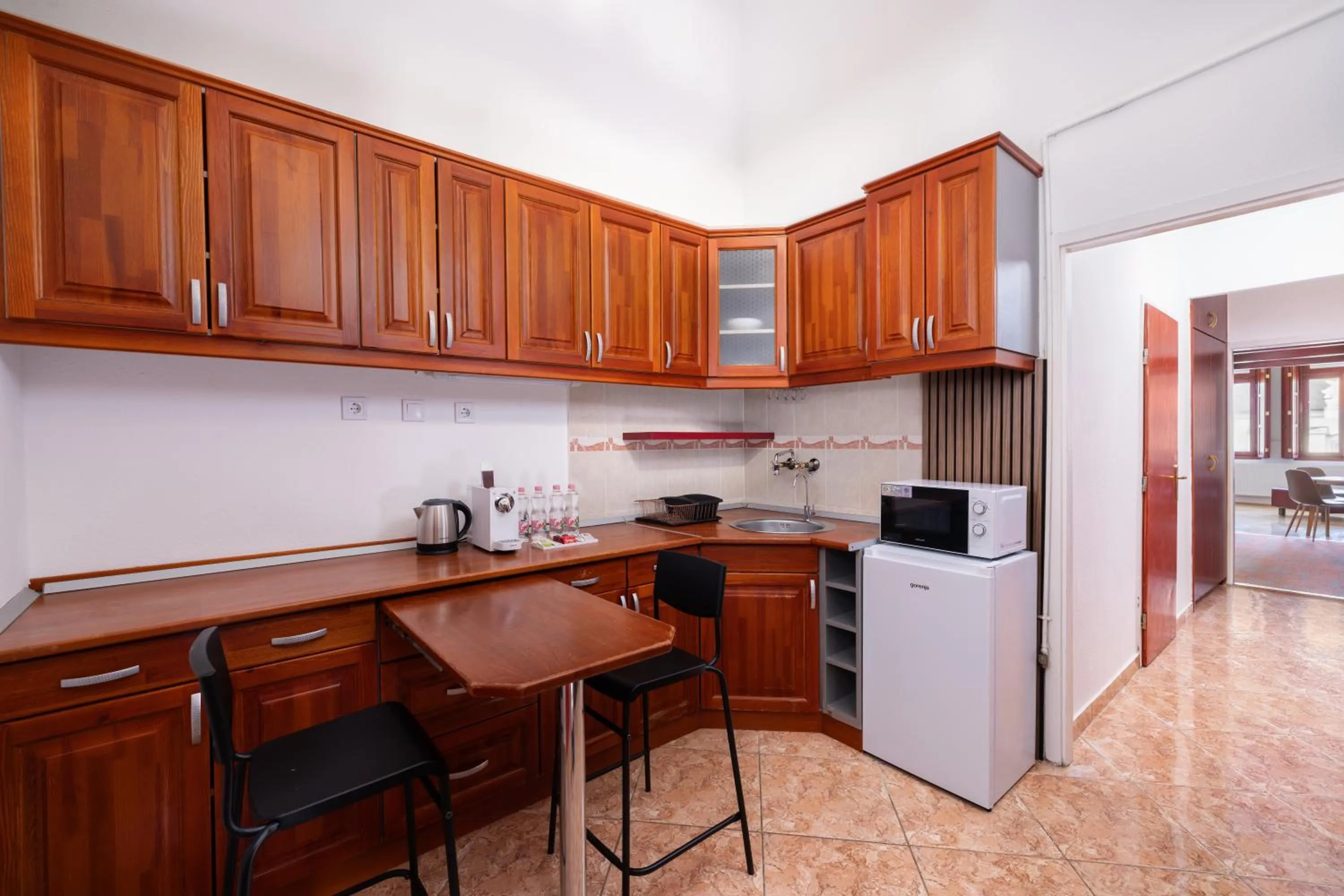 Kitchen or kitchenette in City Hotel Matyas