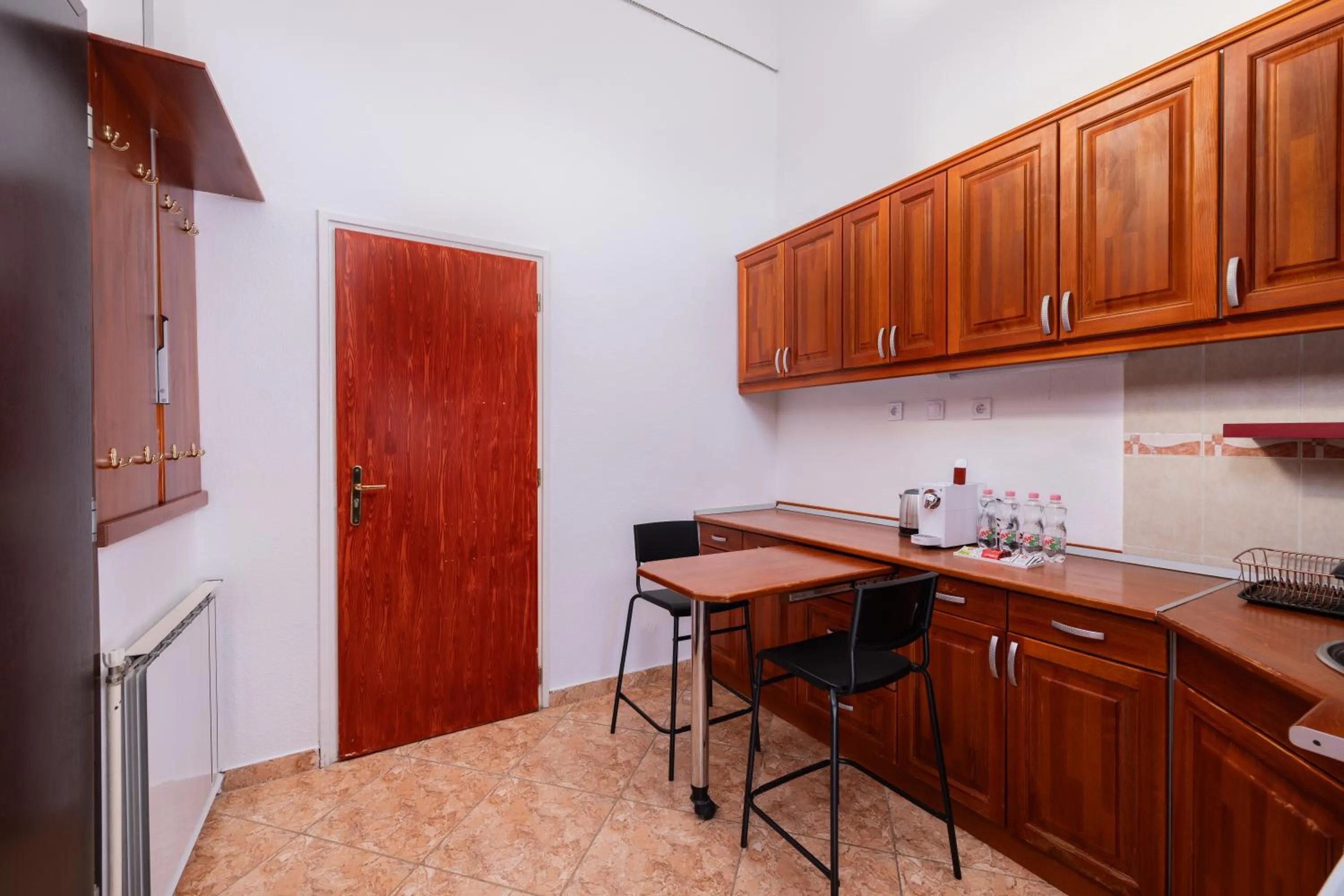 Kitchen or kitchenette in City Hotel Matyas