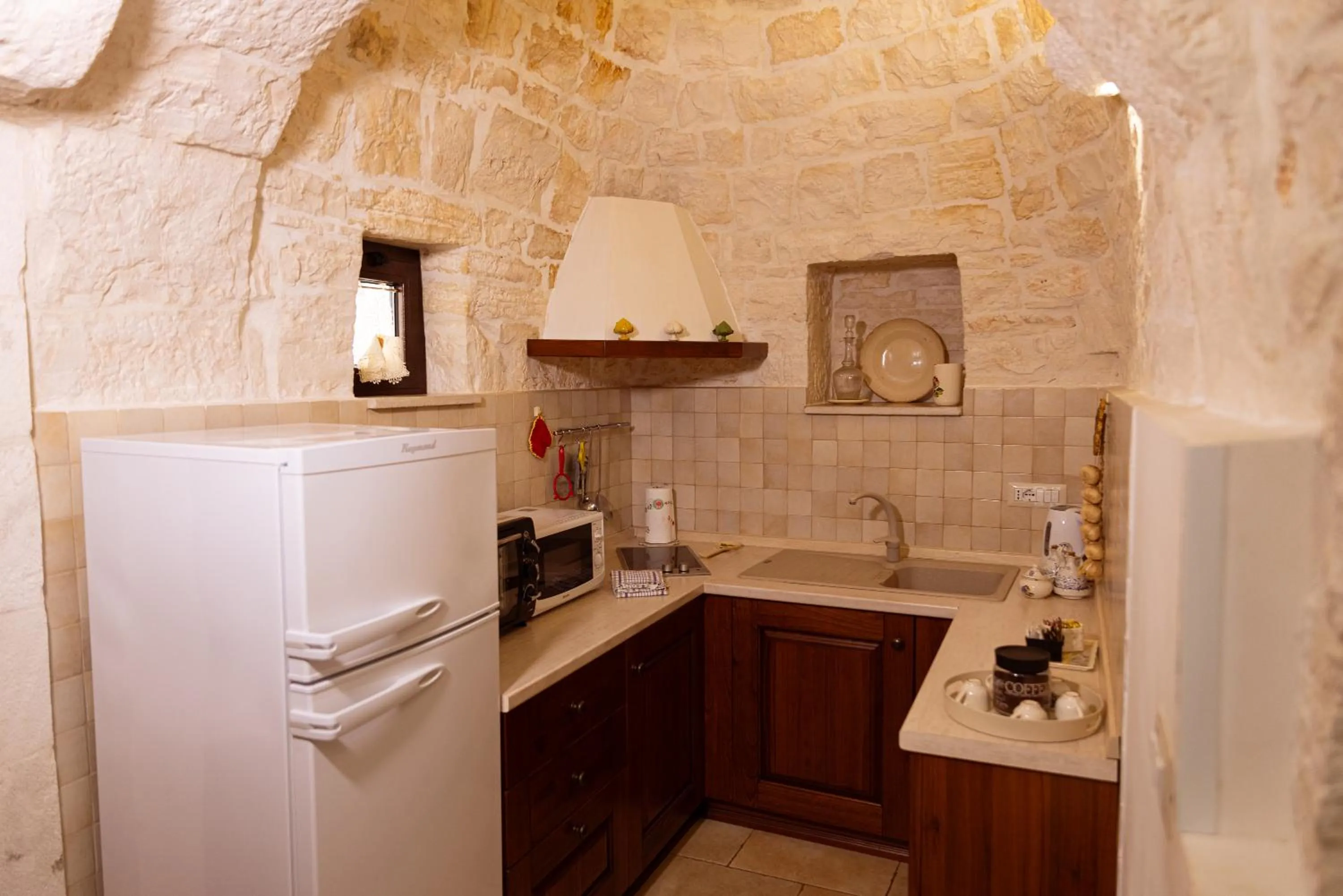 Kitchen or kitchenette in Quei Trulli Divini