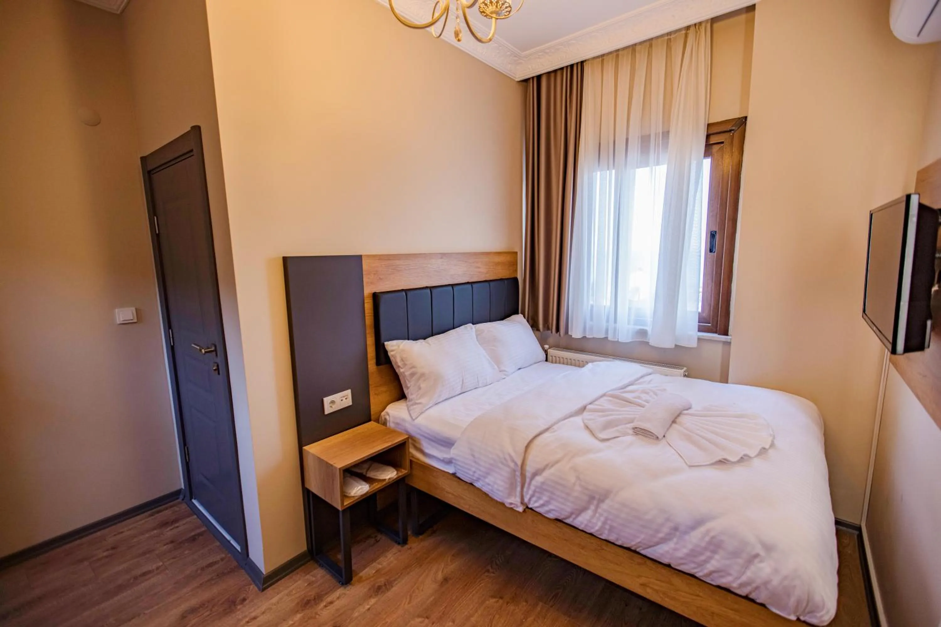 Bed in Grand Balyan Hotel & Restaurant