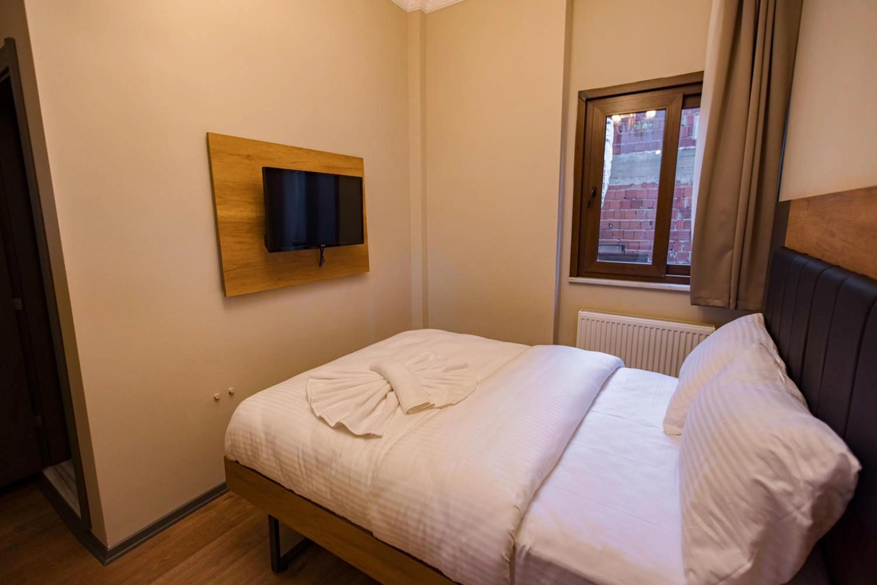 Bed in Grand Balyan Hotel & Restaurant