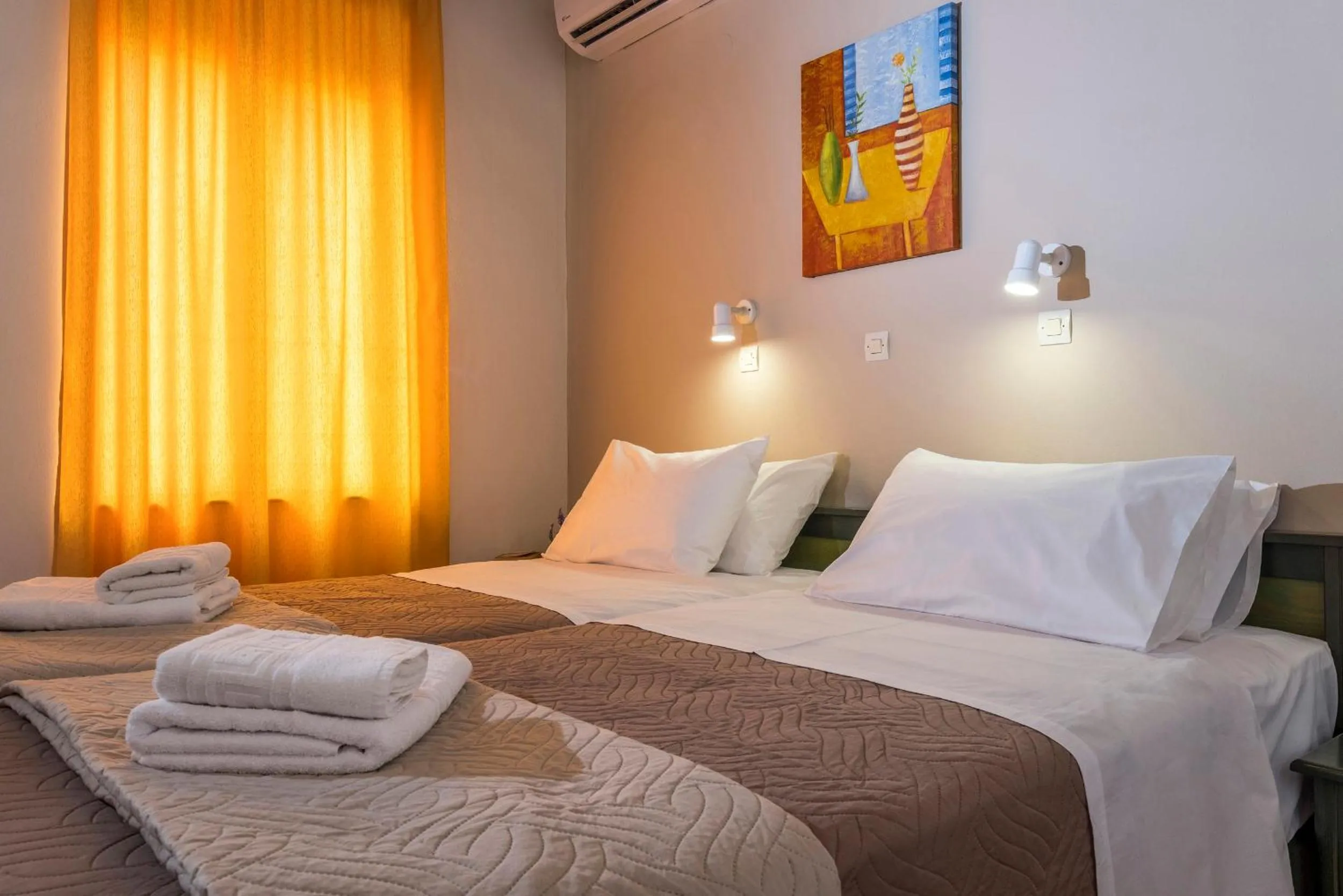 Bed in Theos Holidays Apartments