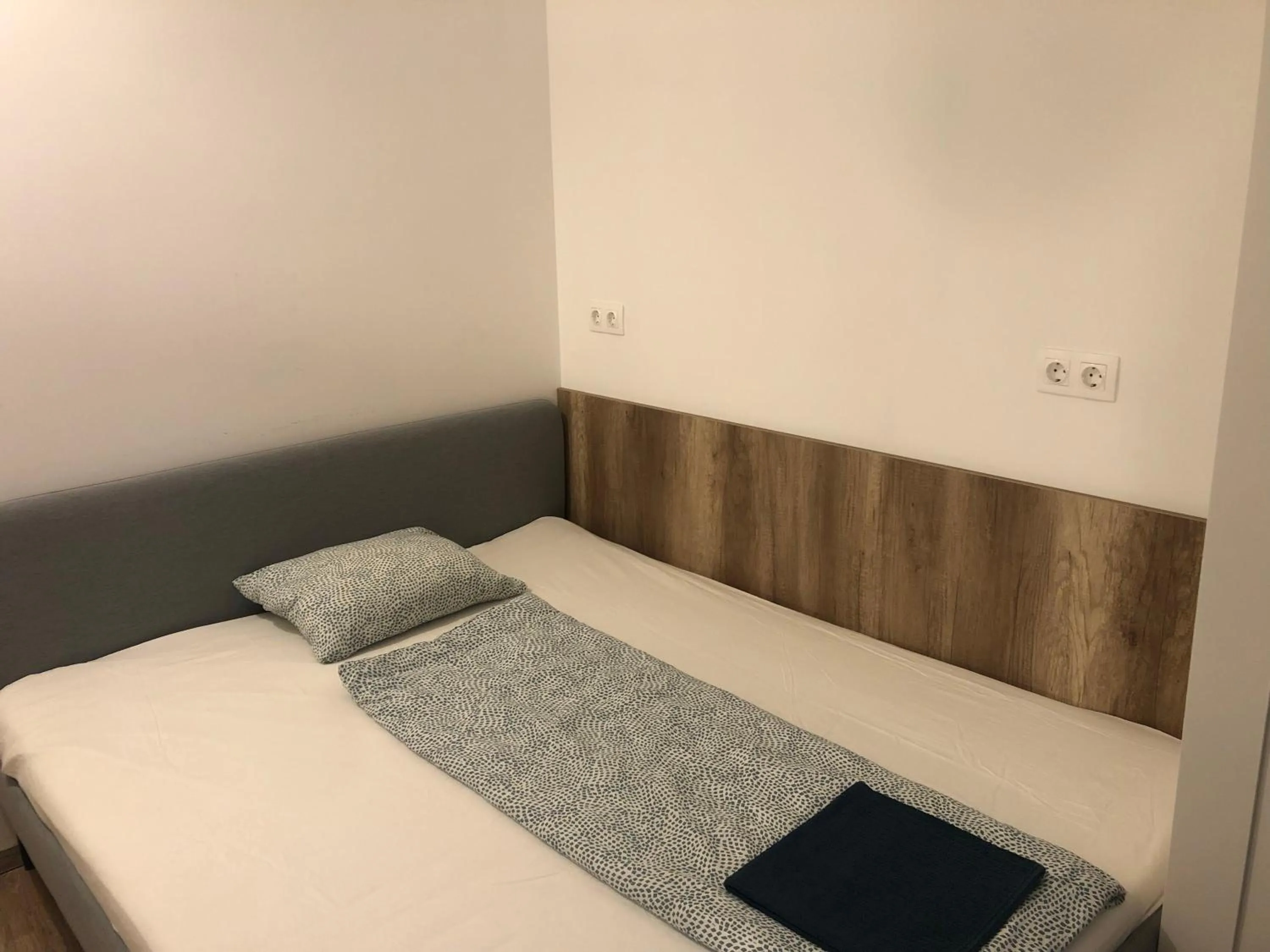 Bed in Omega Apartments Budapest