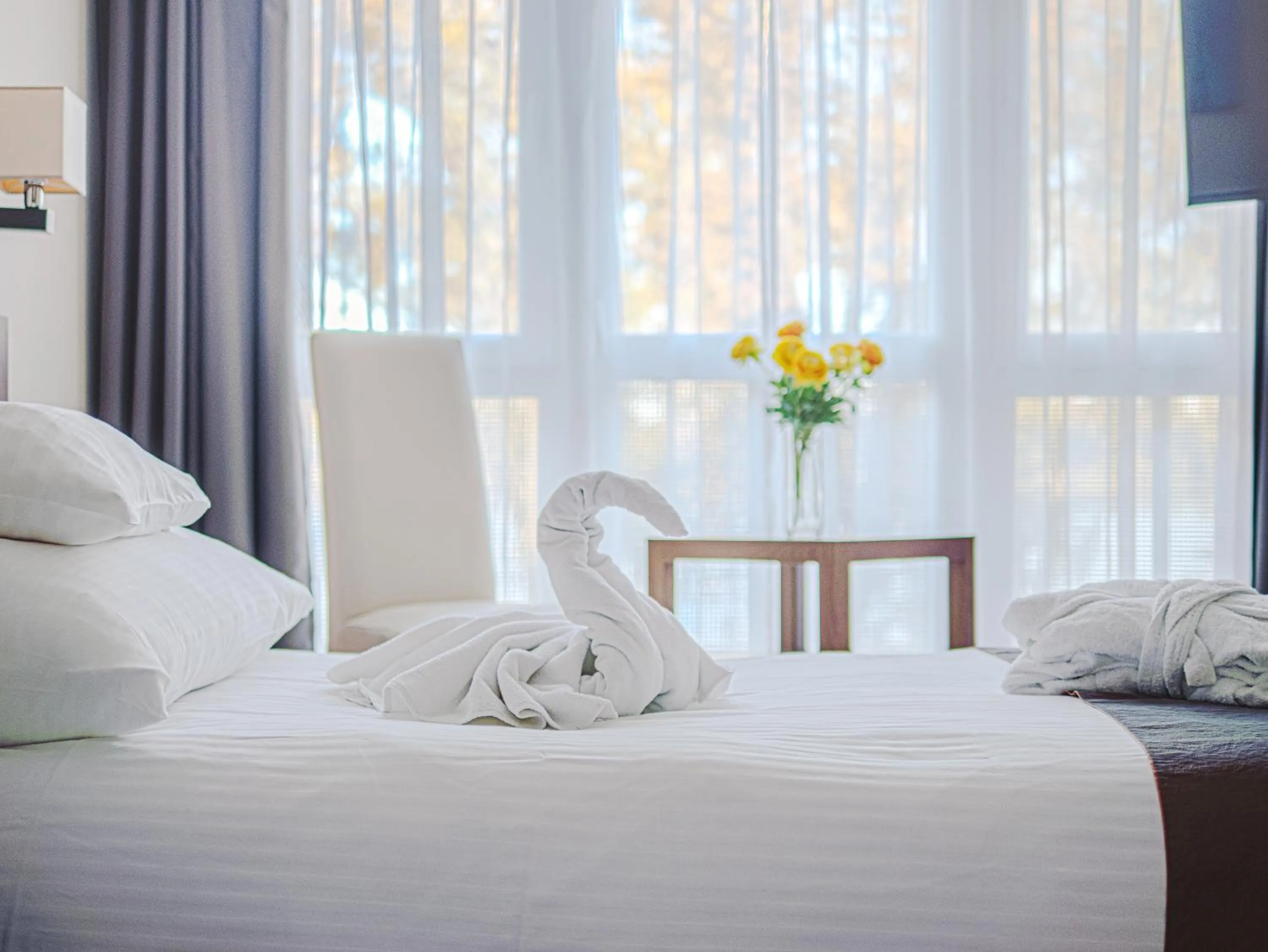 Bed in Holiday Beach Budapest Hotel