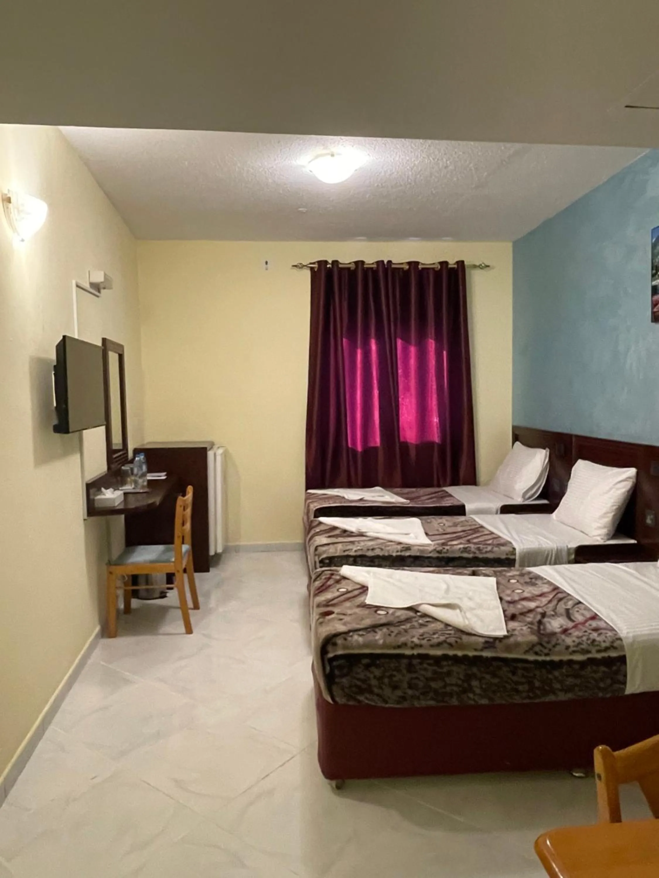 Photo of the whole room, Bed in MOUNT SINA HOTEL By AURA