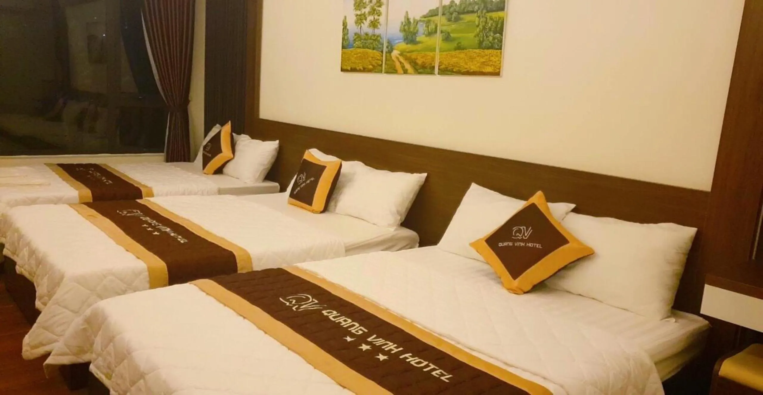 Bed in QUANG VINH HOTEL