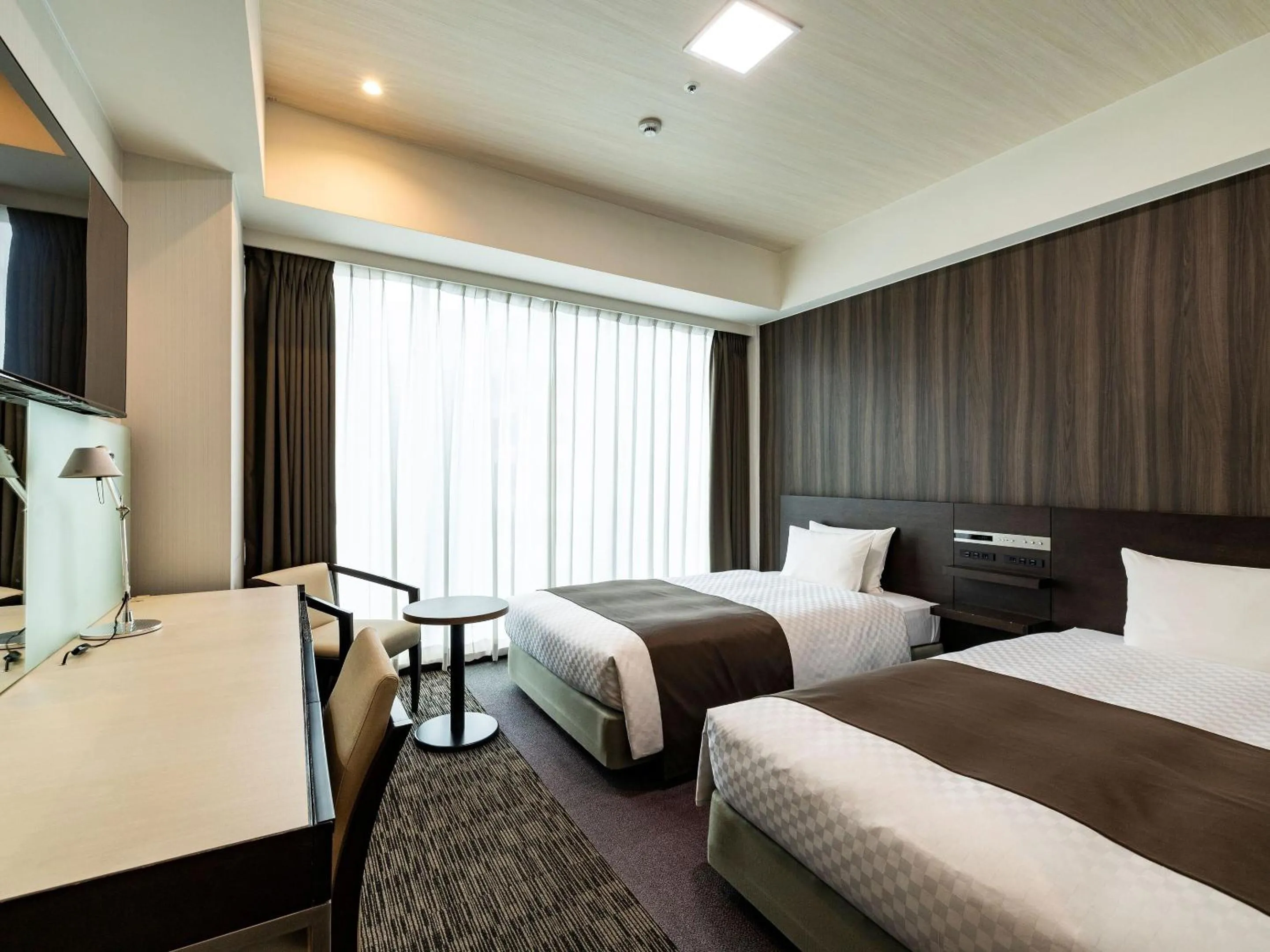 Photo of the whole room, Bed in KOKO HOTEL Premier Hakata - formerly Tenza Hotel at Hakata Station