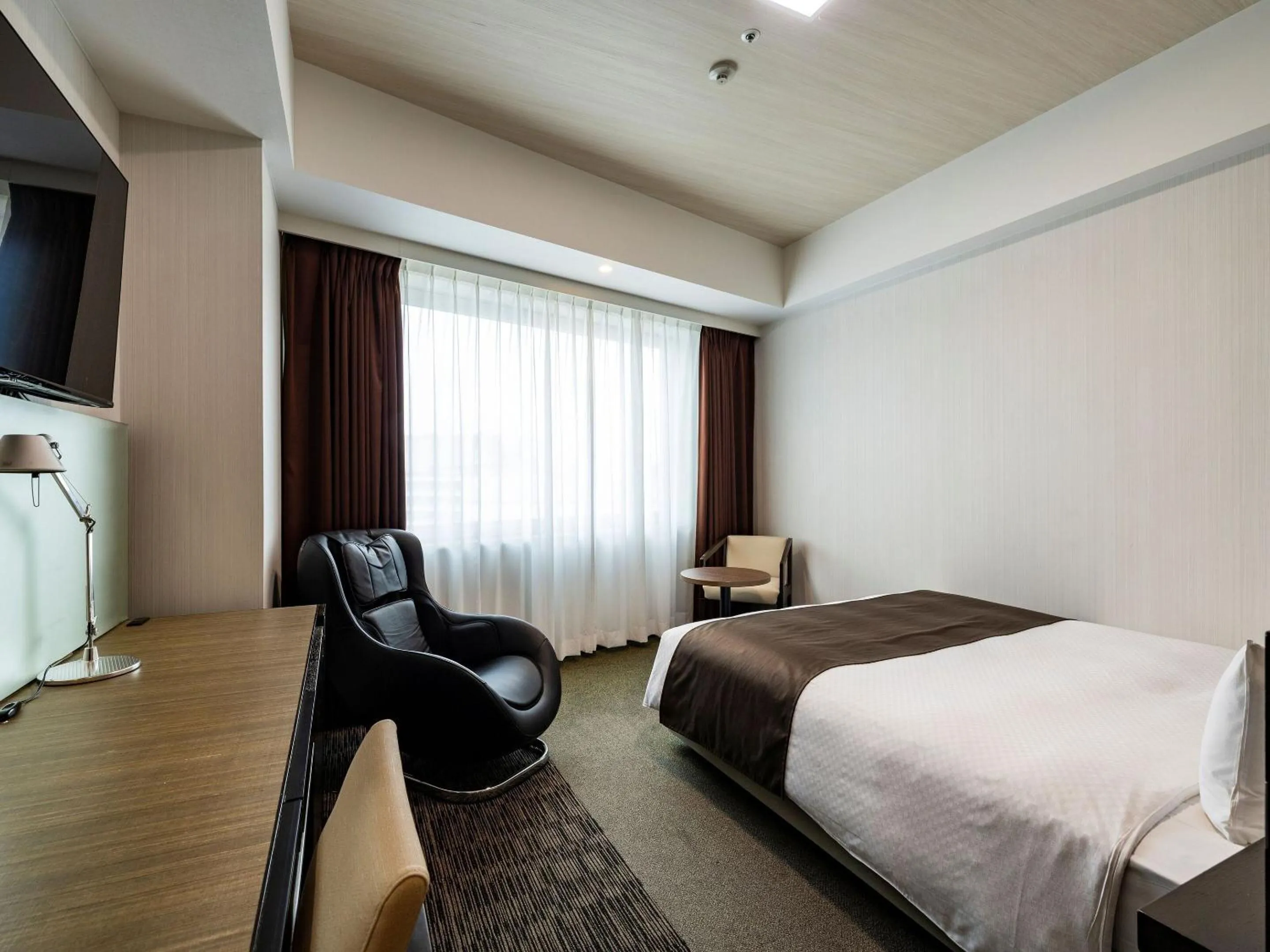 Photo of the whole room, Bed in KOKO HOTEL Premier Hakata - formerly Tenza Hotel at Hakata Station