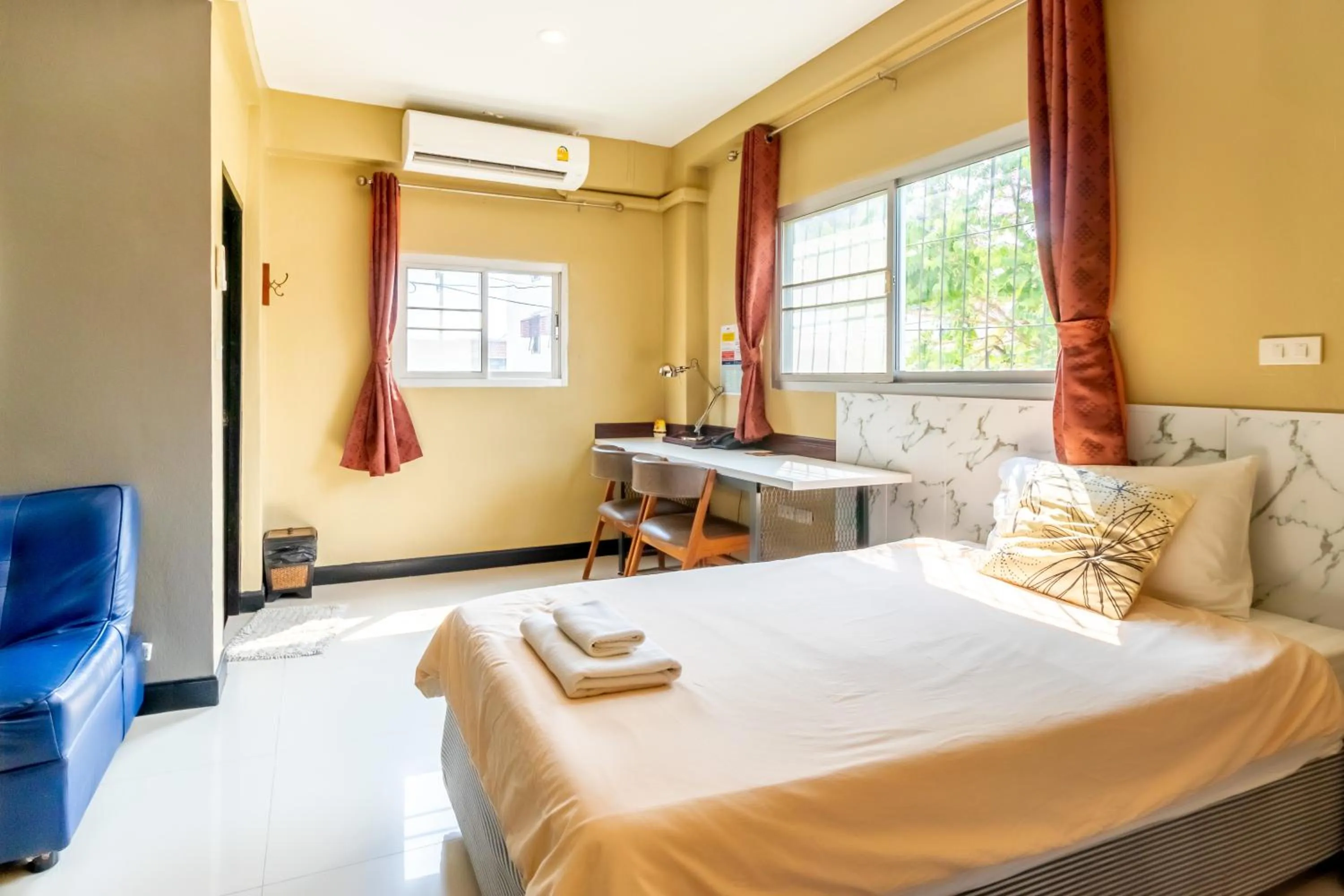 Bed in The Palm Hotel