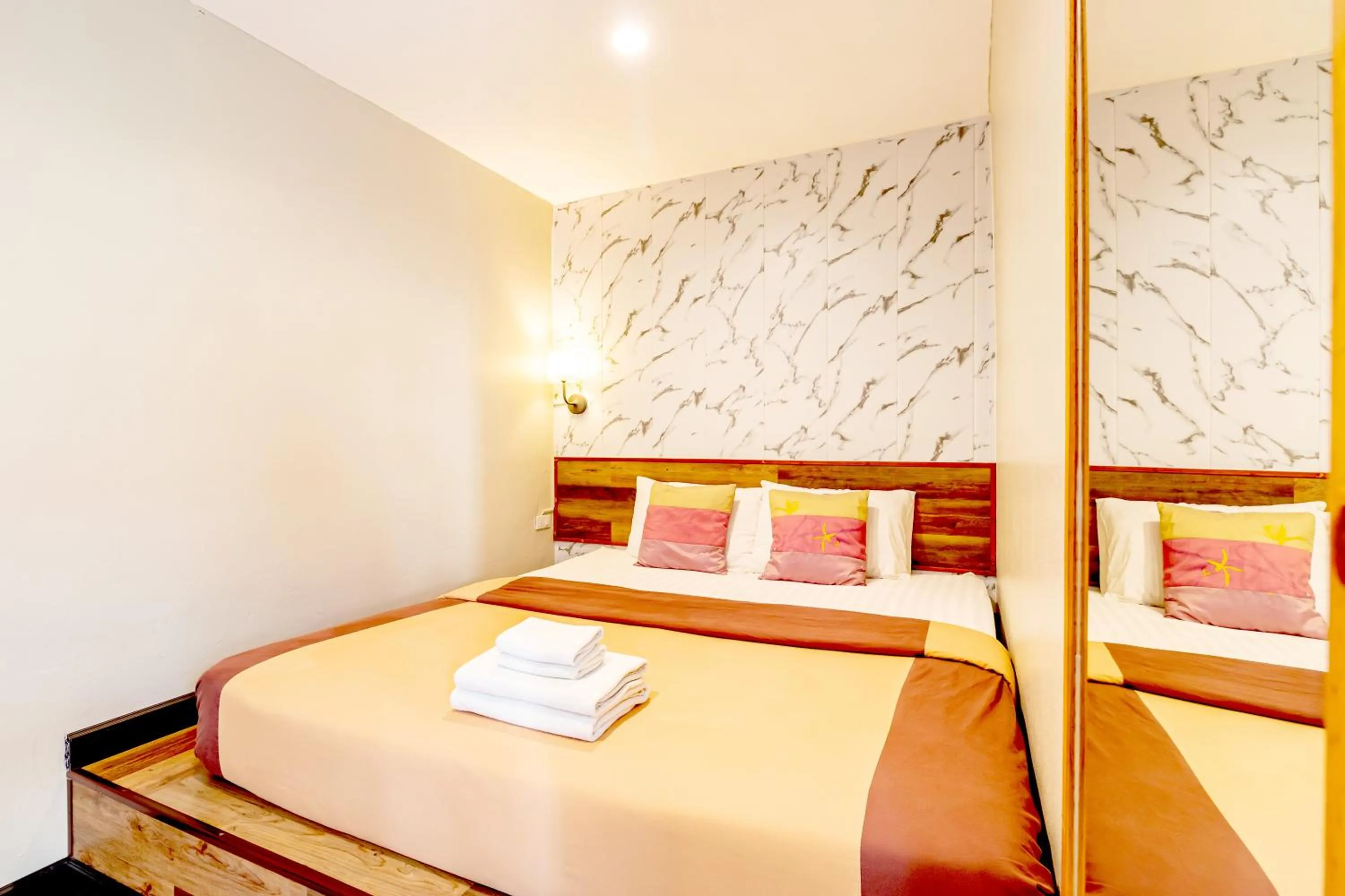 Bed in The Palm Hotel