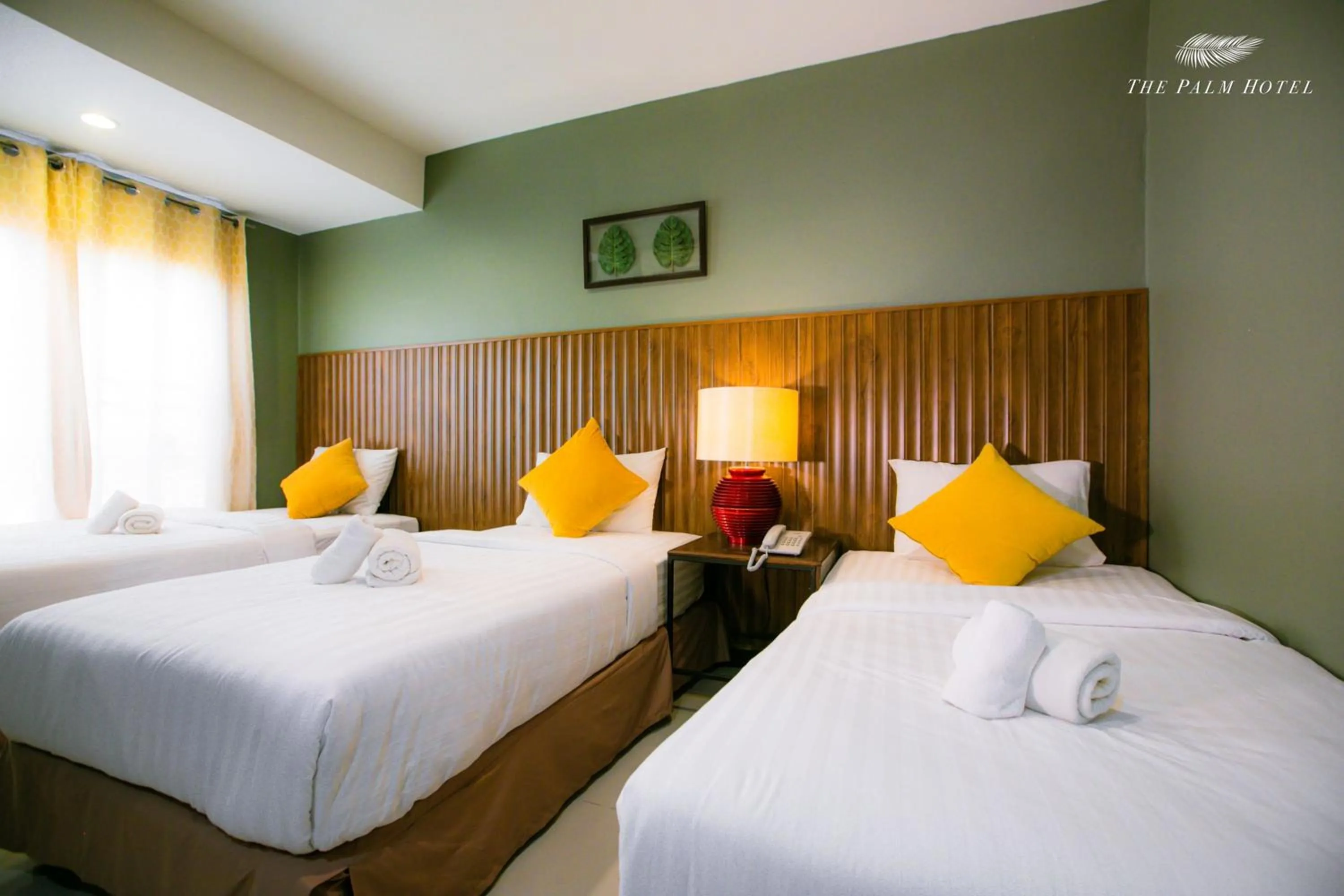 Bed in The Palm Hotel