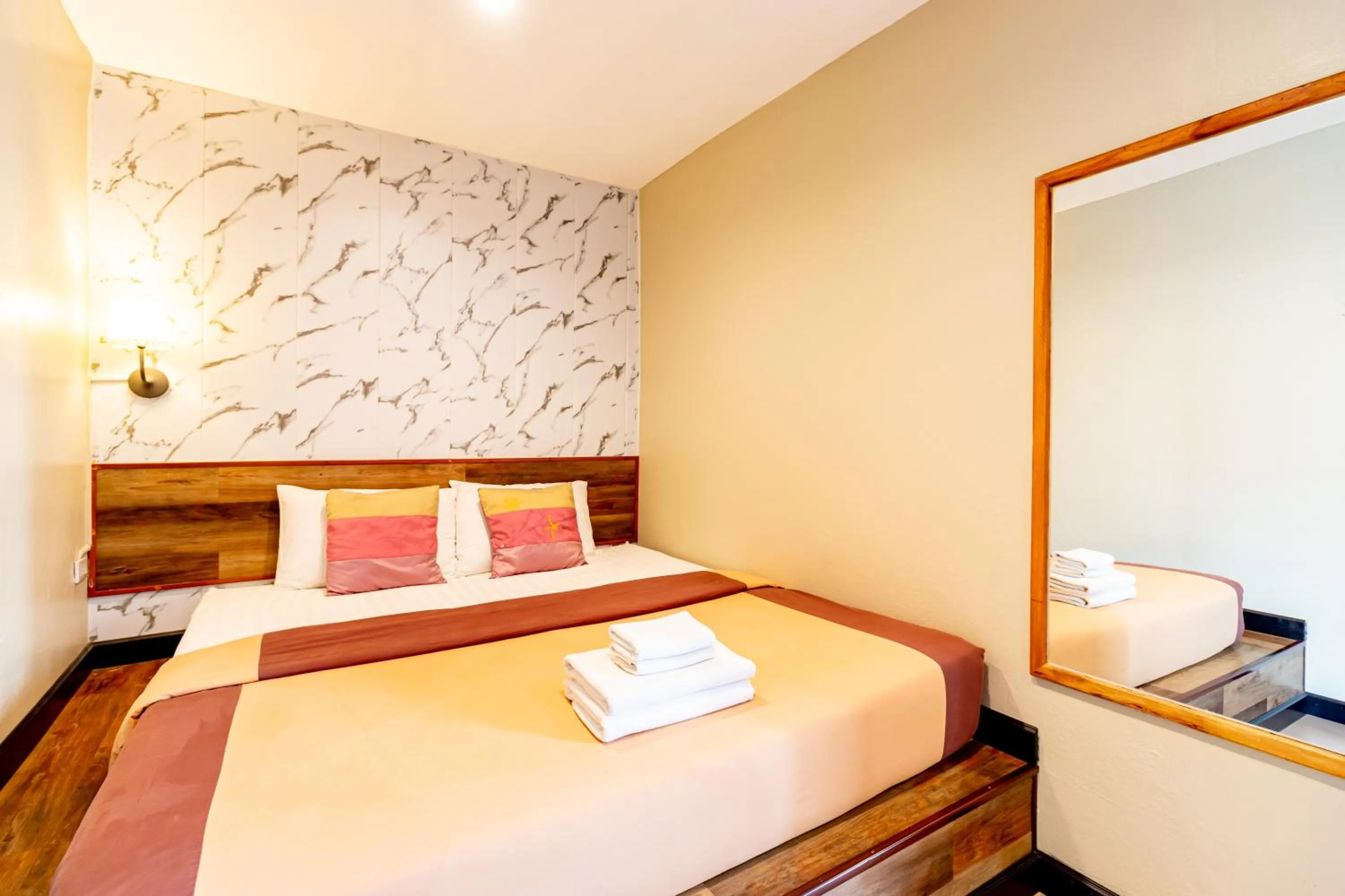 Bed in The Palm Hotel