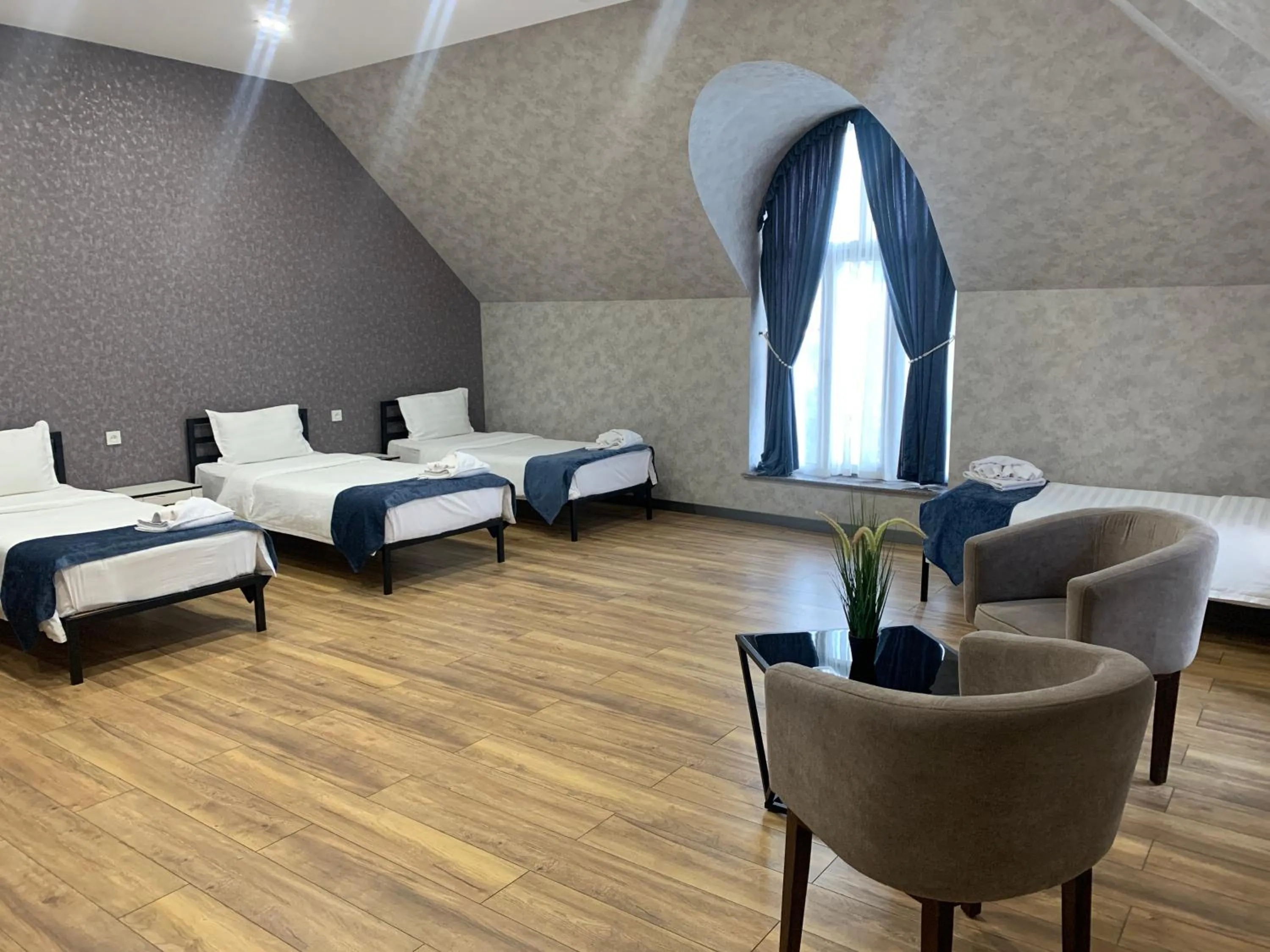 Seating area, Bed in Alpha Plaza Hotel & SPA