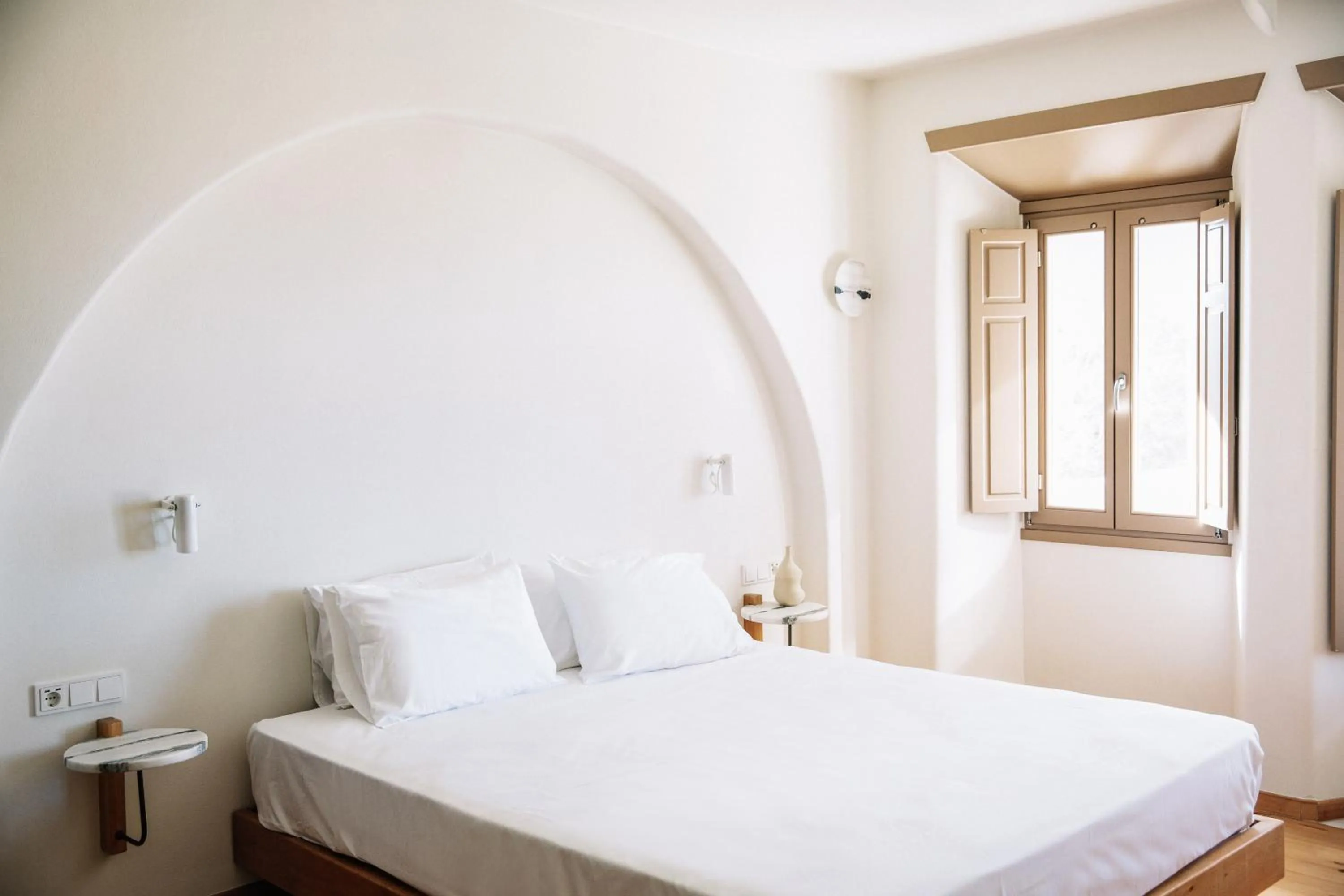 Bed in Ammothines Cycladic Suites