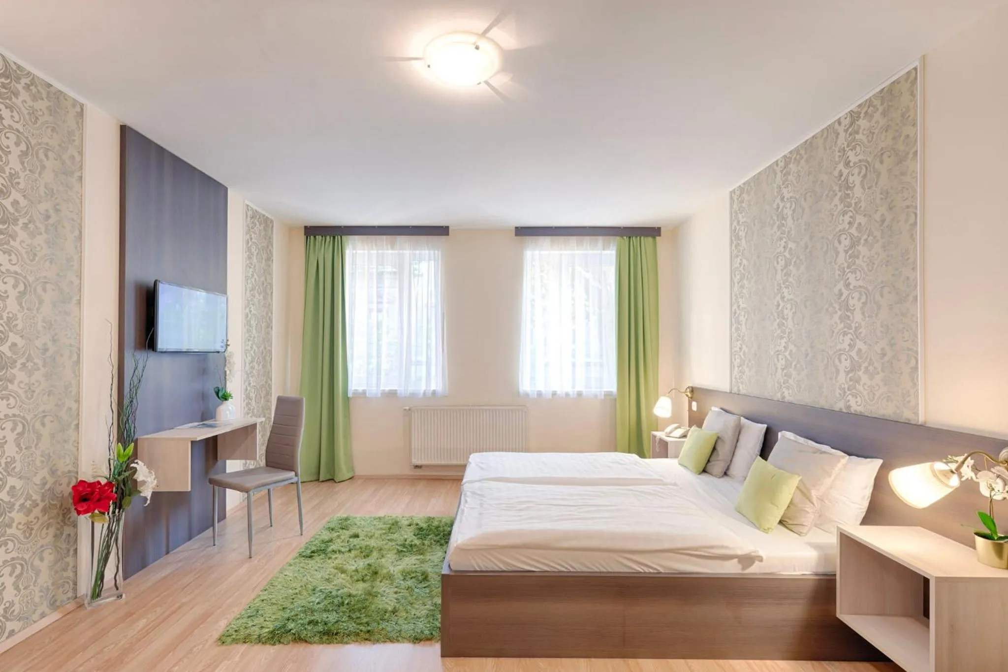 Bed in Triple M Hotel