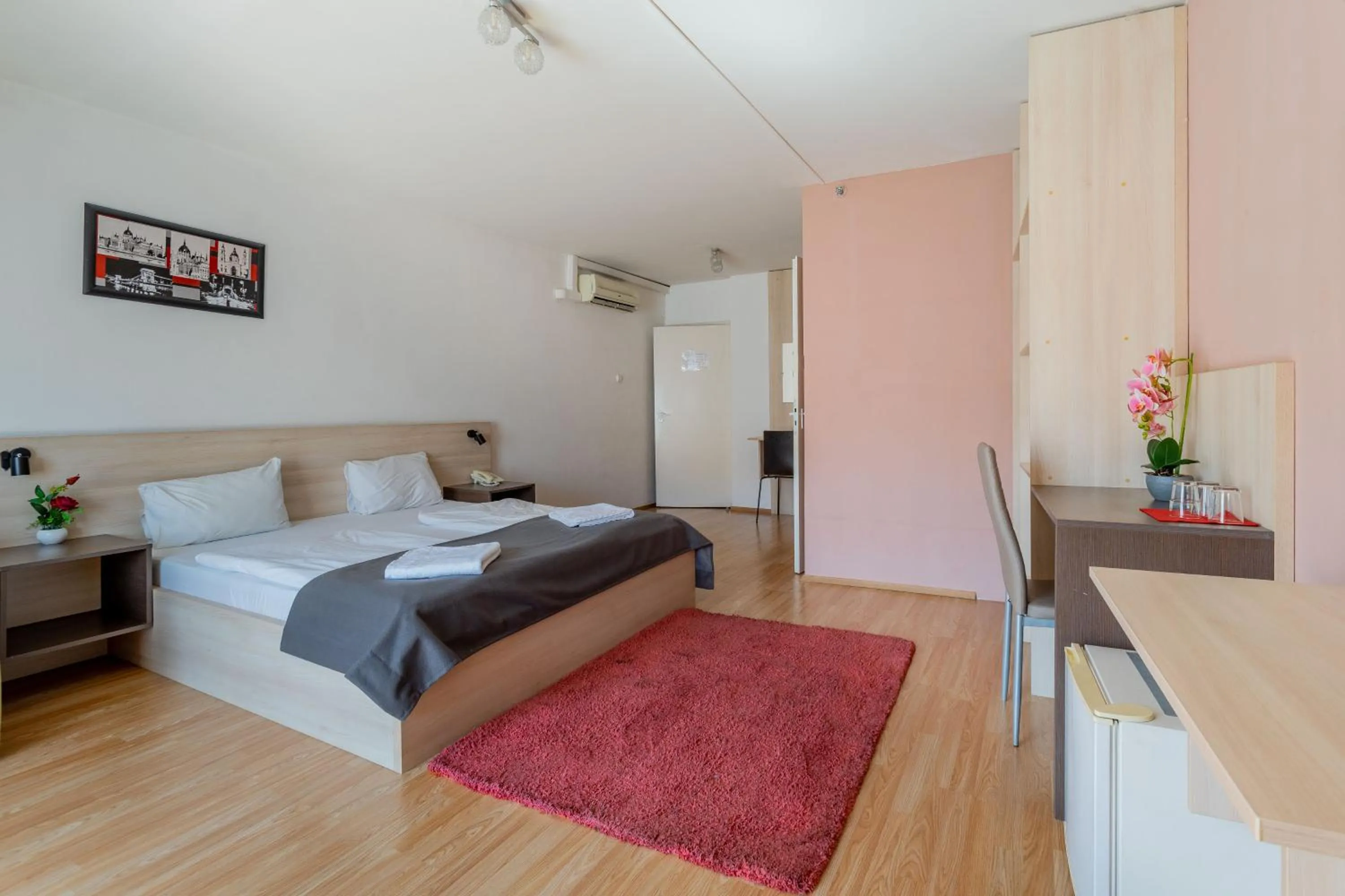 Bed in Triple M Hotel