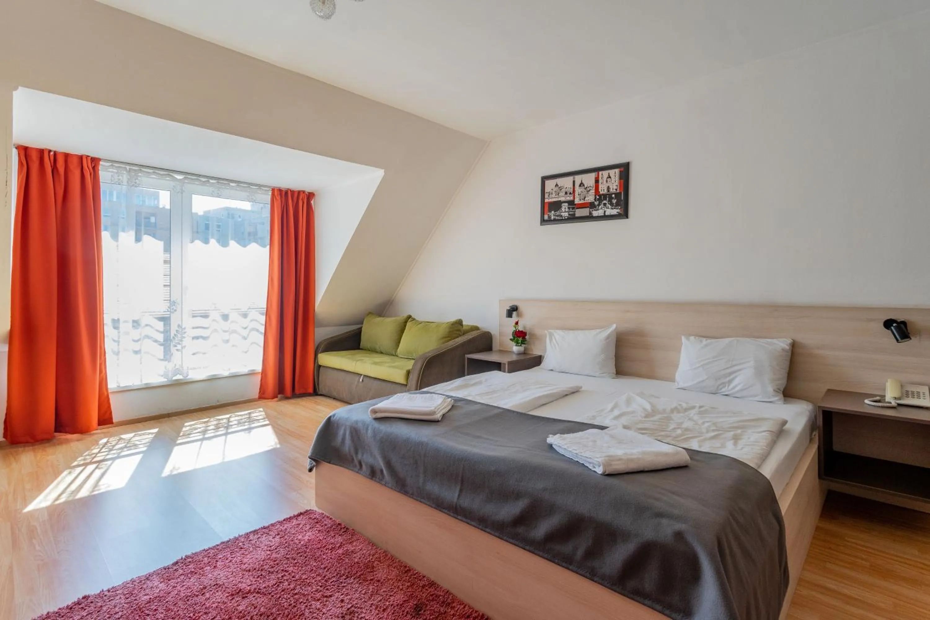 Bed in Triple M Hotel