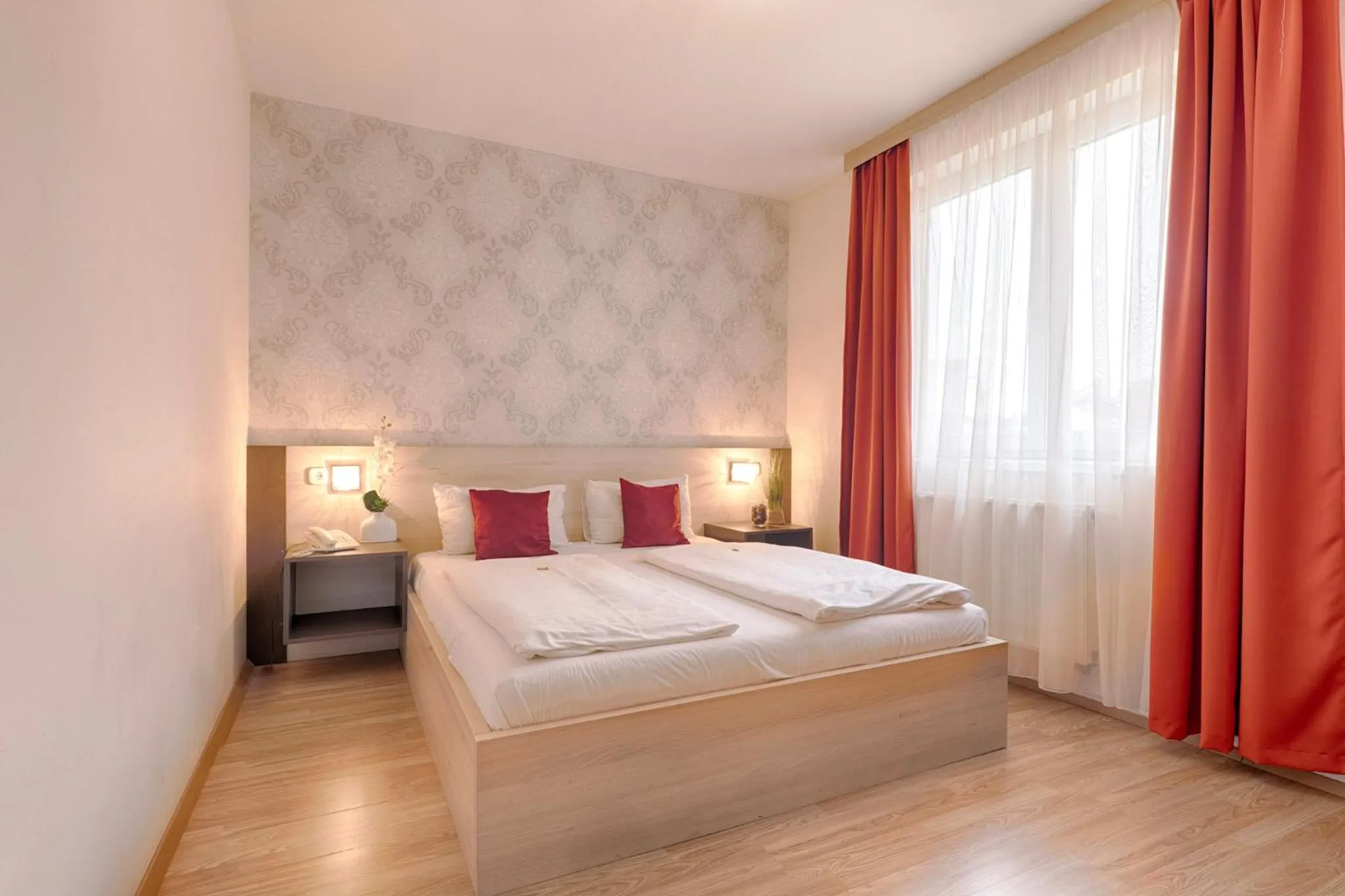 Bed in Triple M Hotel