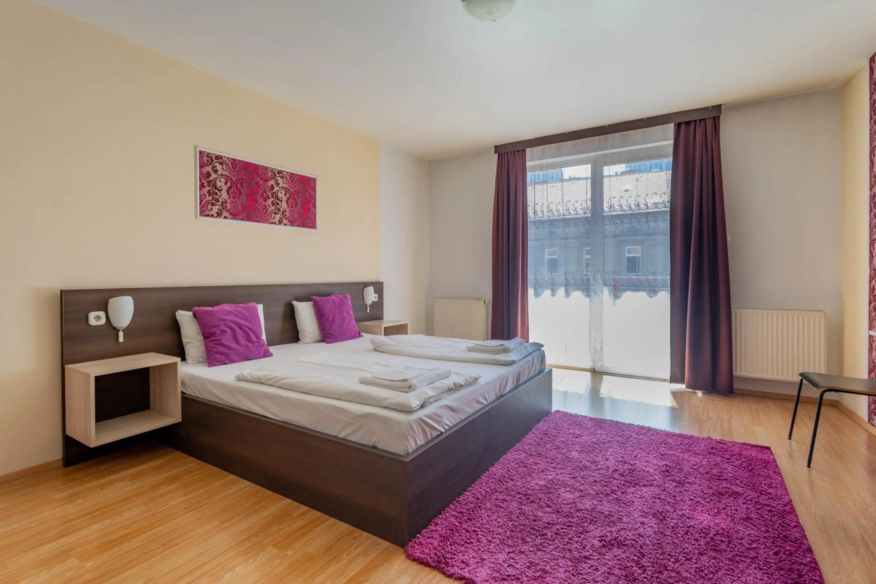 Bed in Triple M Hotel