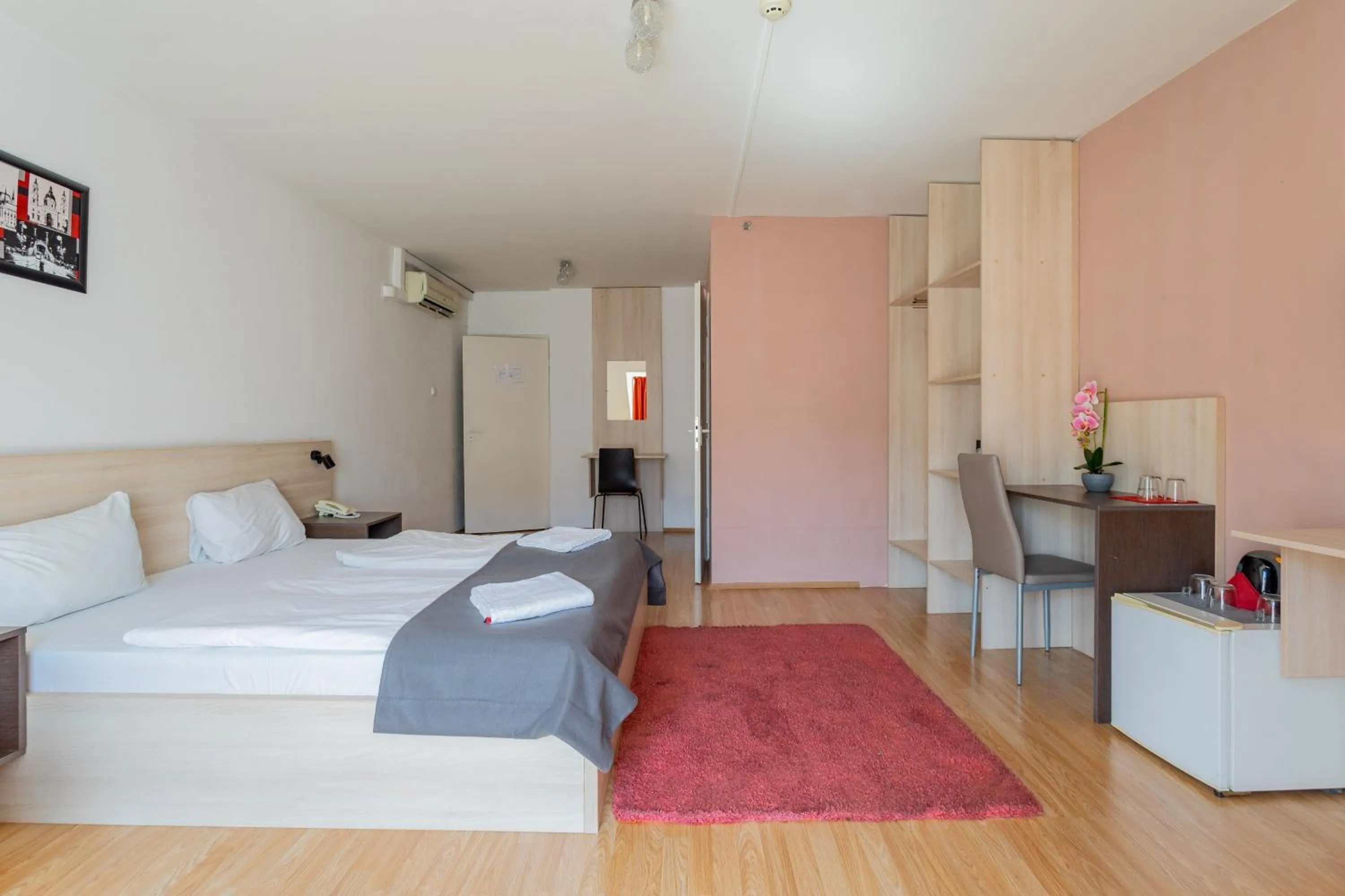 Bed in Triple M Hotel