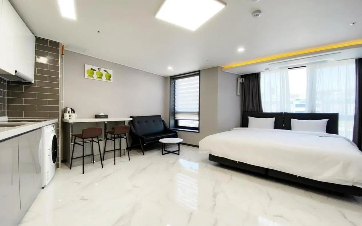 Bed in Songjeong Blue Castle Hotel