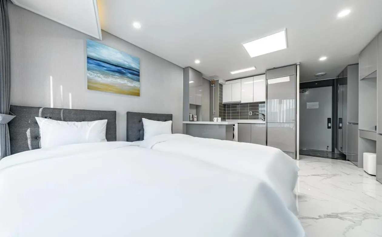 Bed in Songjeong Blue Castle Hotel