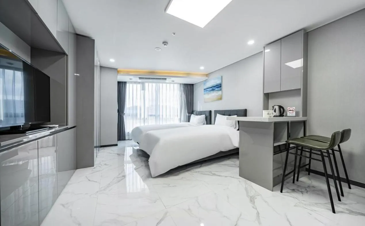 Bed in Songjeong Blue Castle Hotel