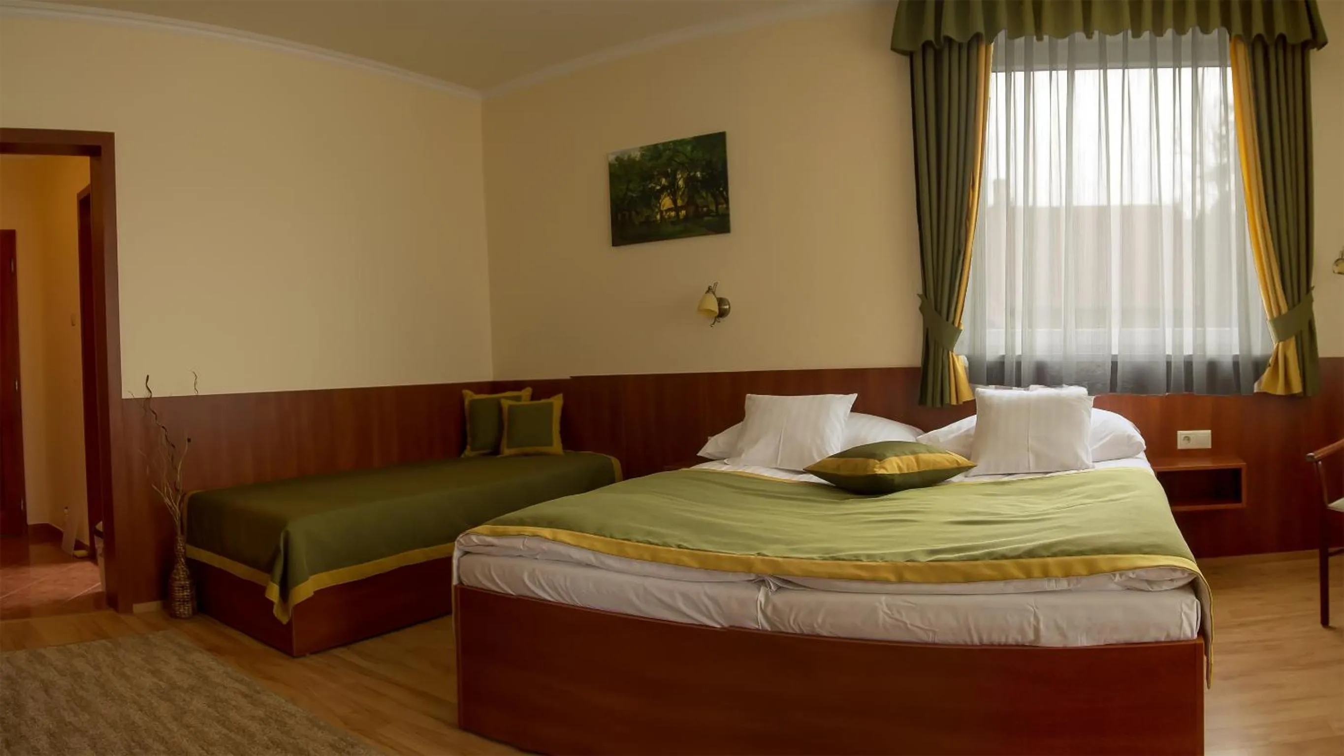 Bed in Apartman Bella Hotel