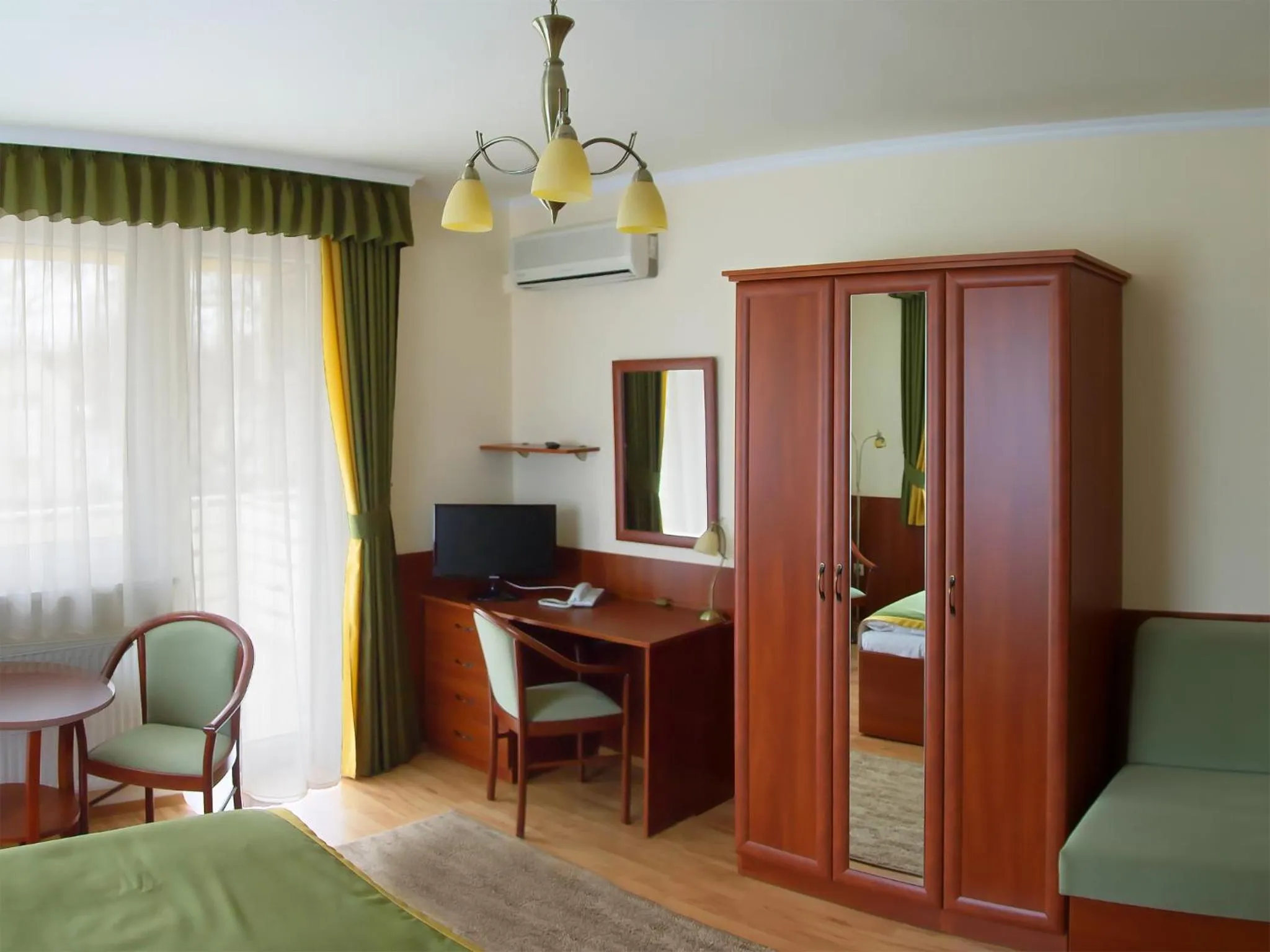 Bed in Apartman Bella Hotel