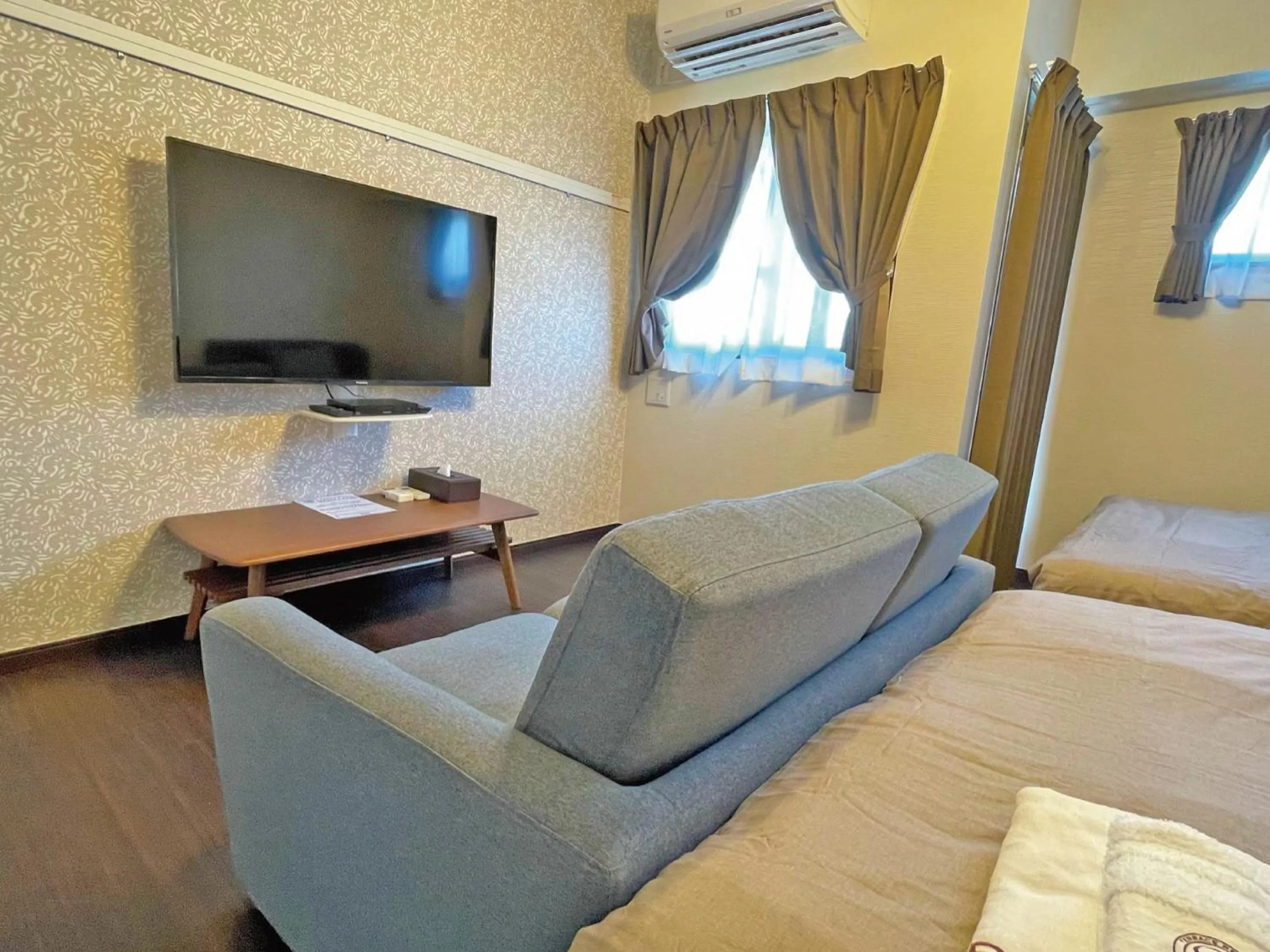 Living room, Bed in Terrace Resort Mihama Chatan
