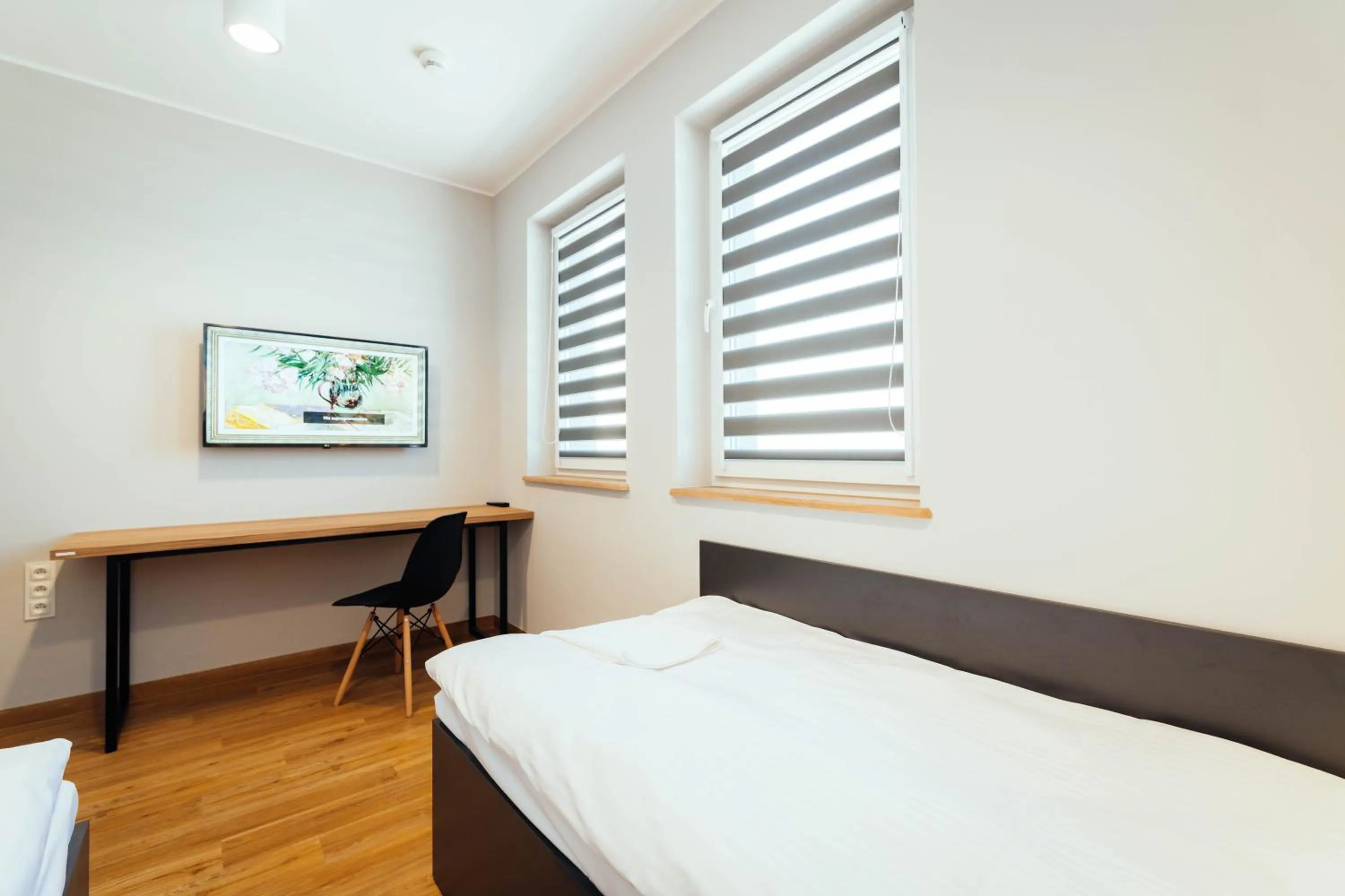 Photo of the whole room, Bed in blue hotel