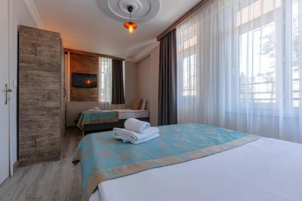 Bed in Seven City Hotel