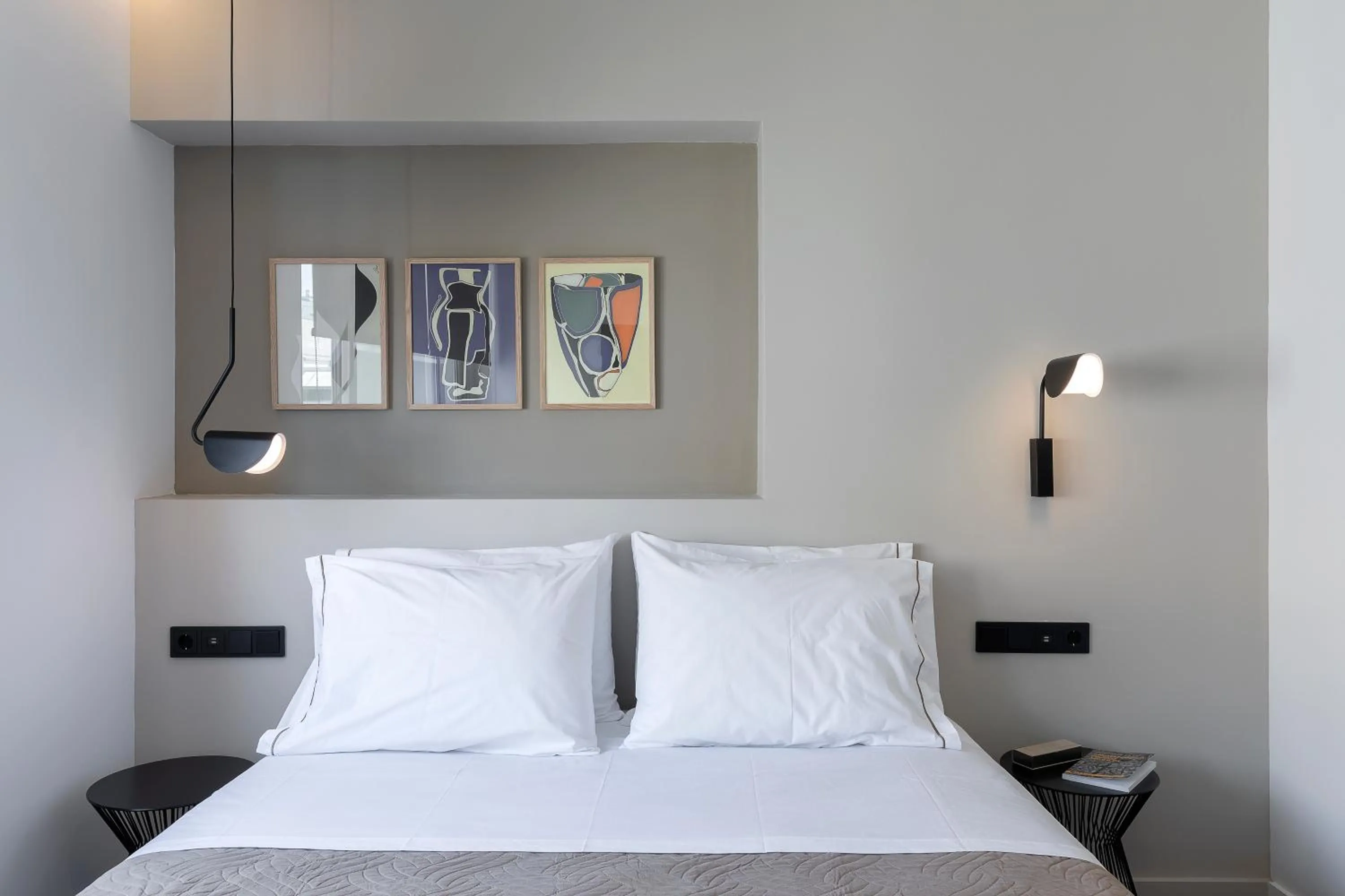 Bed in The Athenians Art Apartments