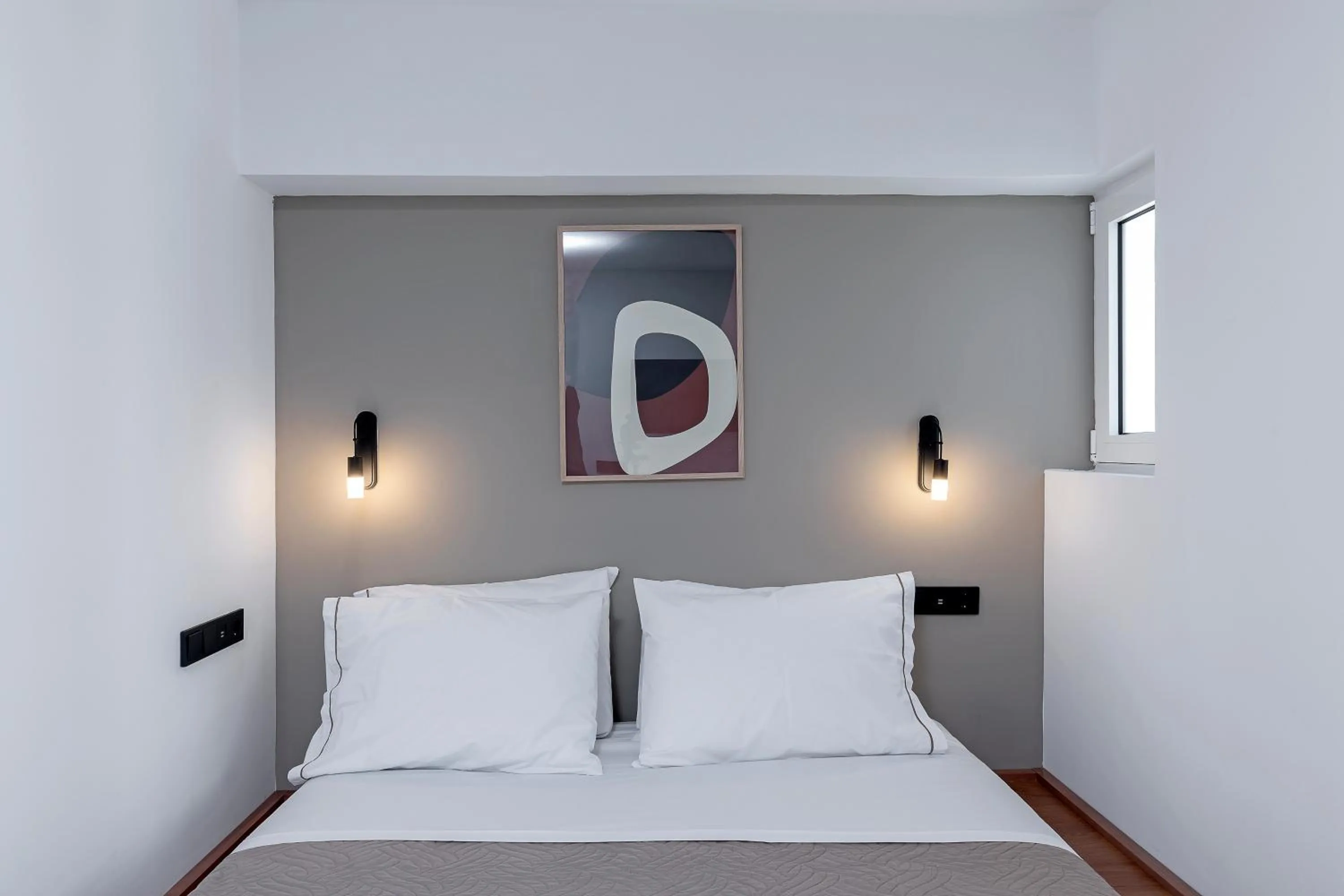 Bed in The Athenians Art Apartments