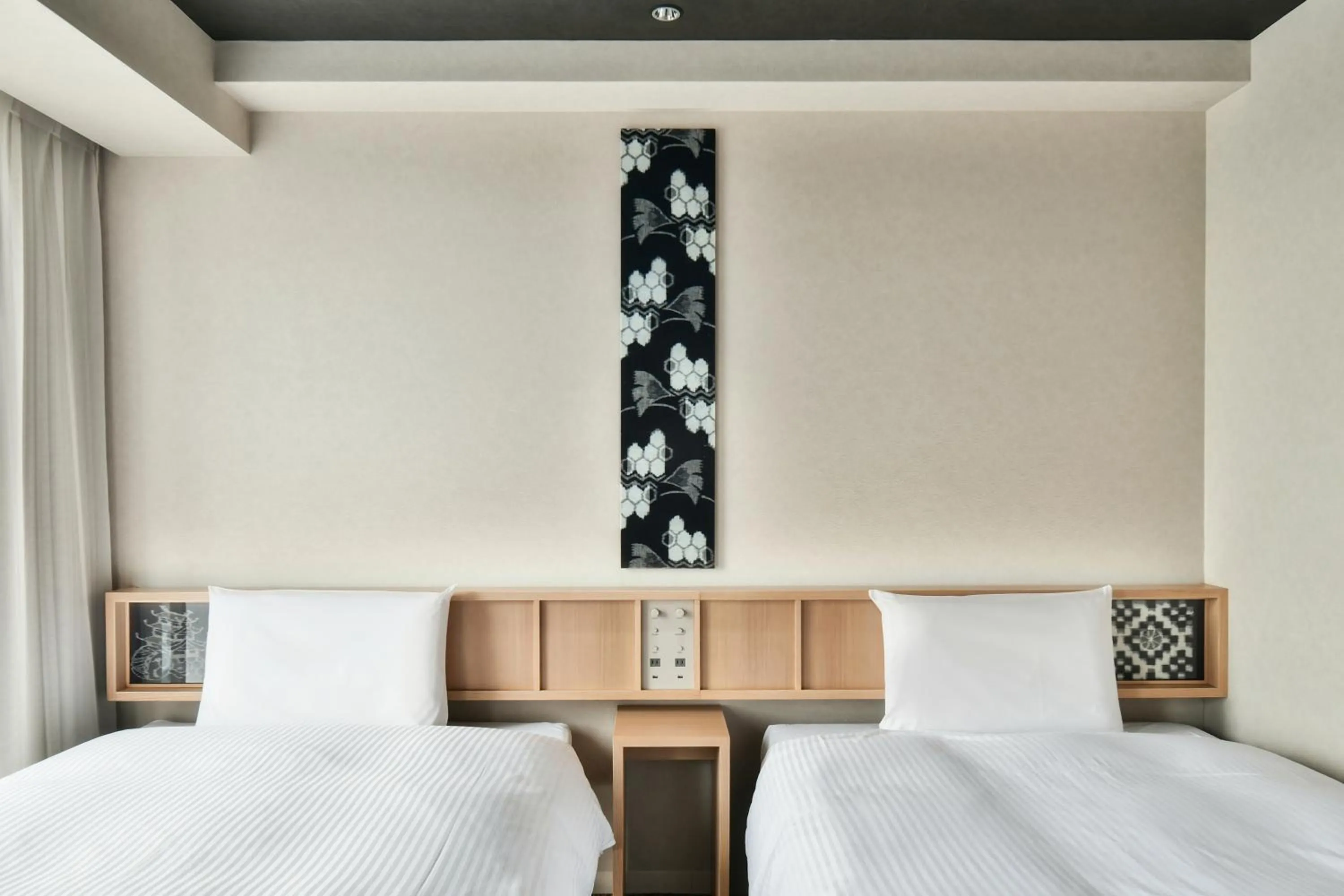 Bed in REF Matsuyama City Station by VESSEL HOTELS