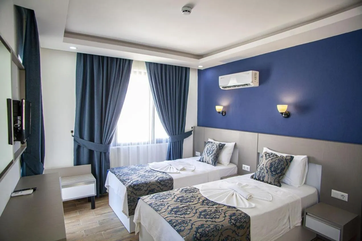 Bed in Demyra Boutique Hotel