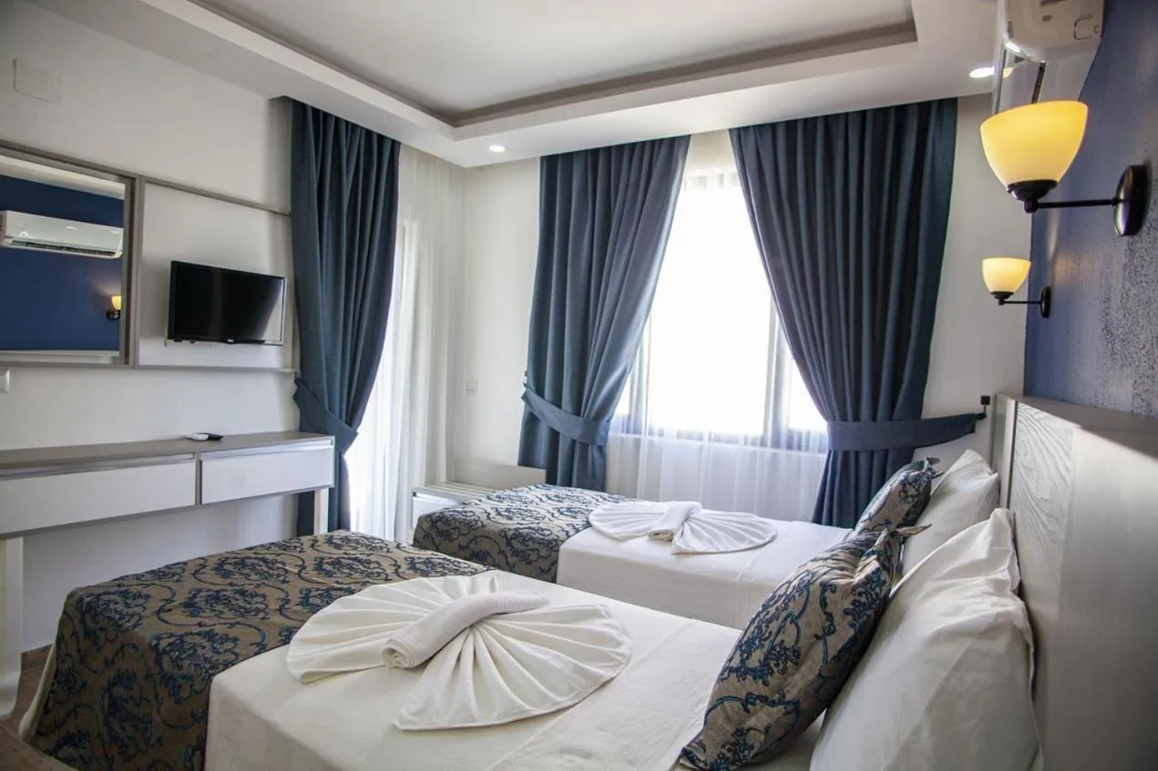Bed in Demyra Boutique Hotel