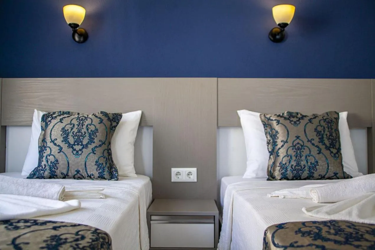 Bed in Demyra Boutique Hotel