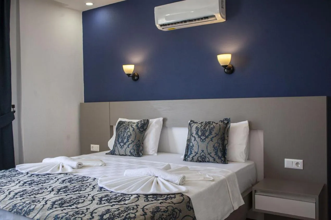 Bed in Demyra Boutique Hotel