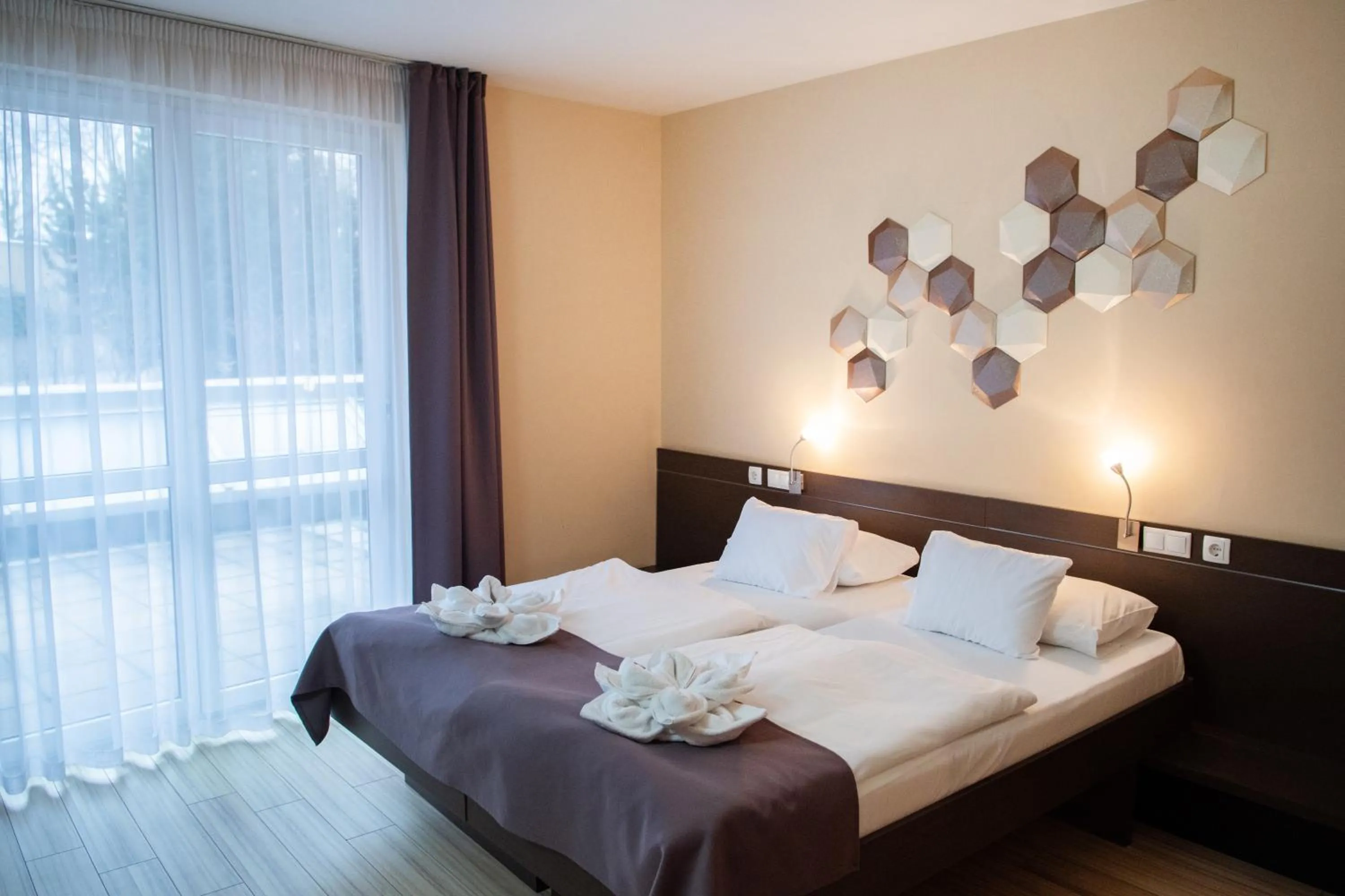 Bed in CE Plaza Hotel