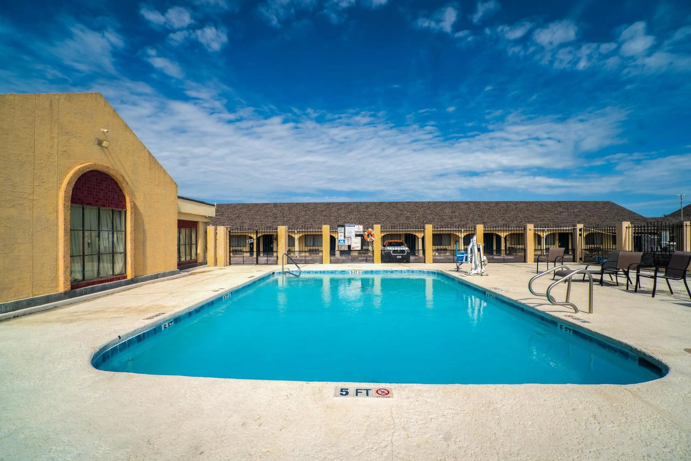 Swimming pool in Aransas Bay Inn & Suites Corpus Christi by OYO