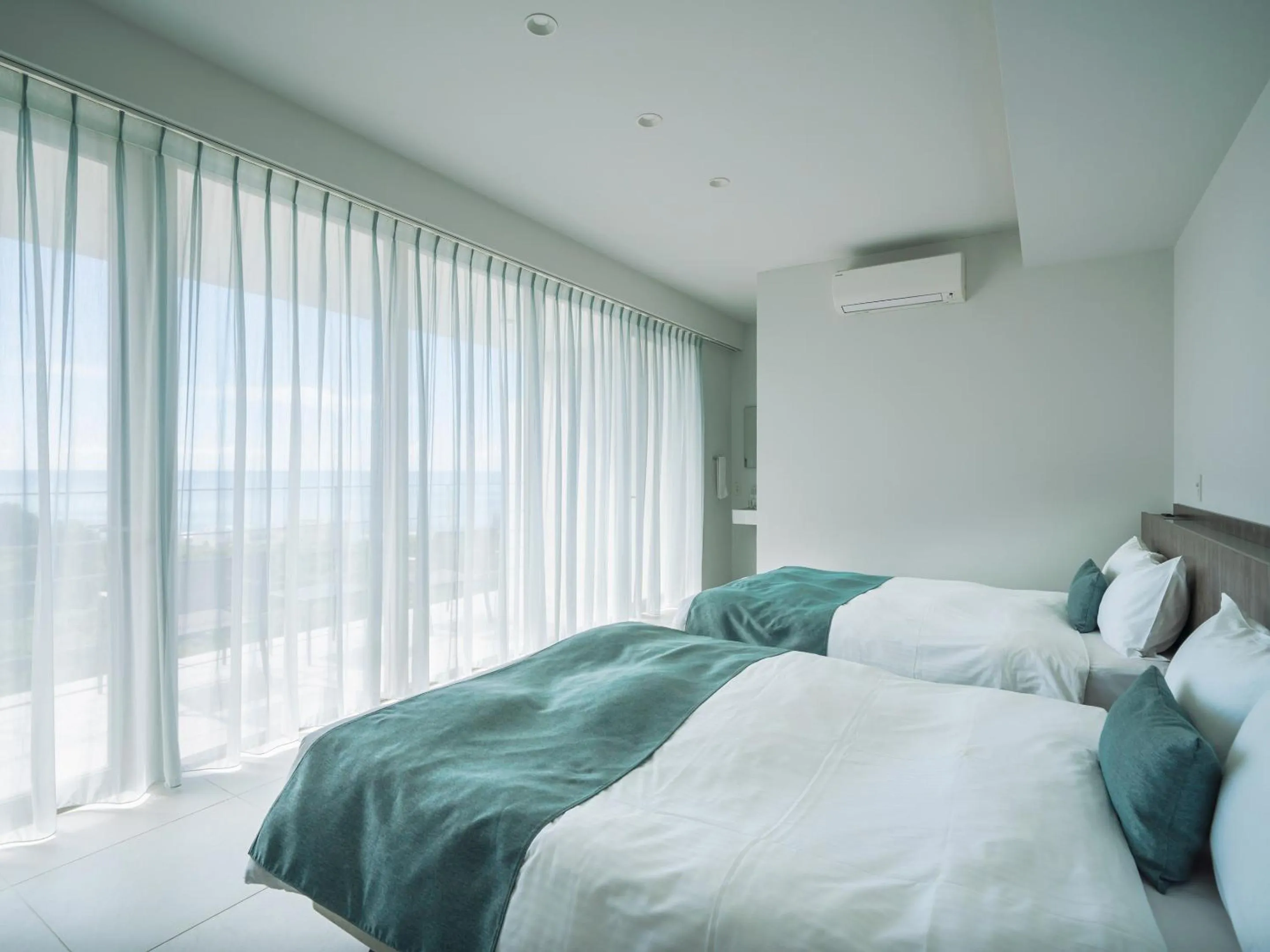 Photo of the whole room, Bed in Blue Rela Luxe Resort Okinawa